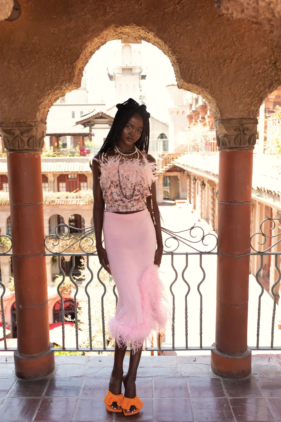 Grey flower top with pink feather details and pearl buttons made by ANDREEVA
