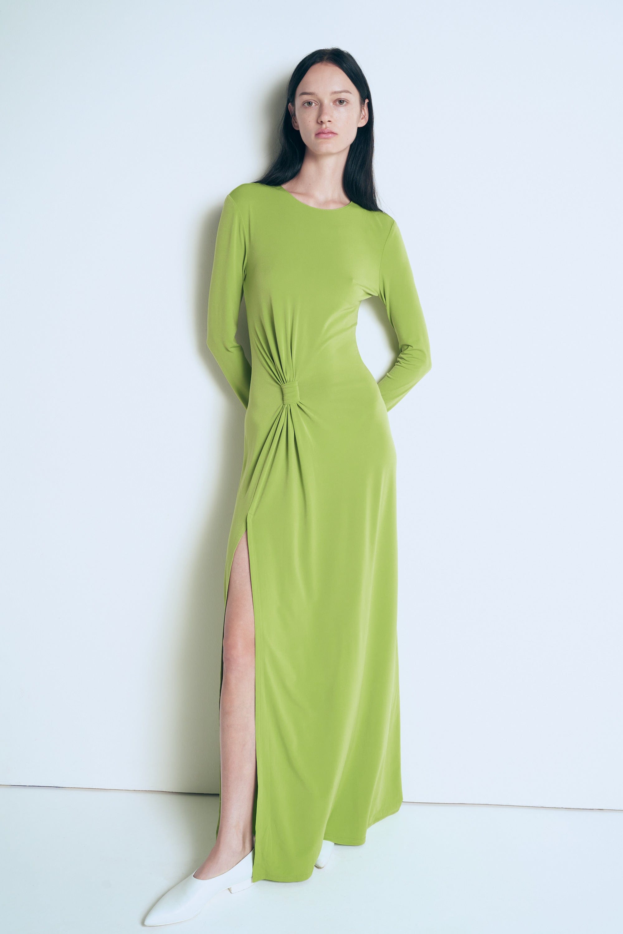 Green knitted dress with a knot made by A.M.G