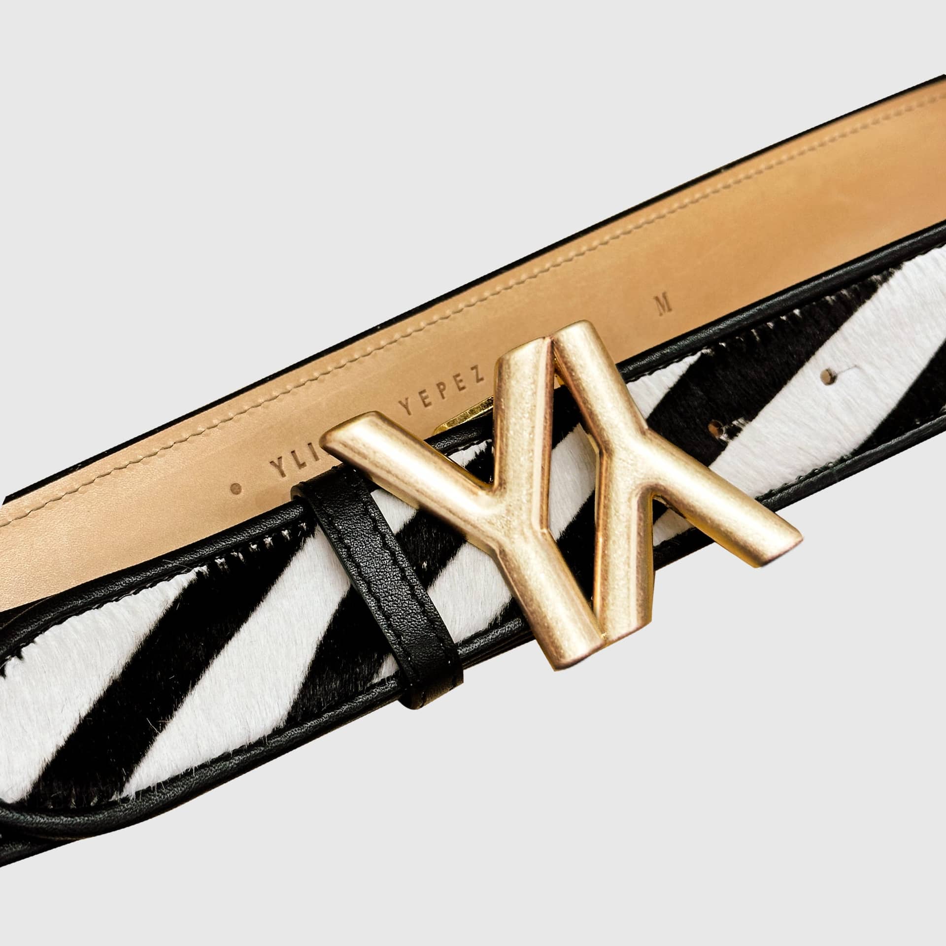 Monogram Buckle with belt calf hair zebra made by Yliana Yepez