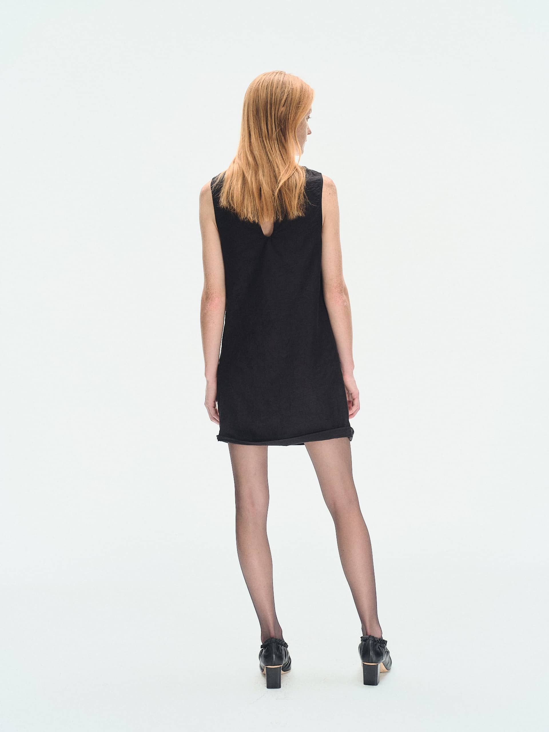 BLACK TEXTURED DRAPED MINI DRESS made by YIBRI