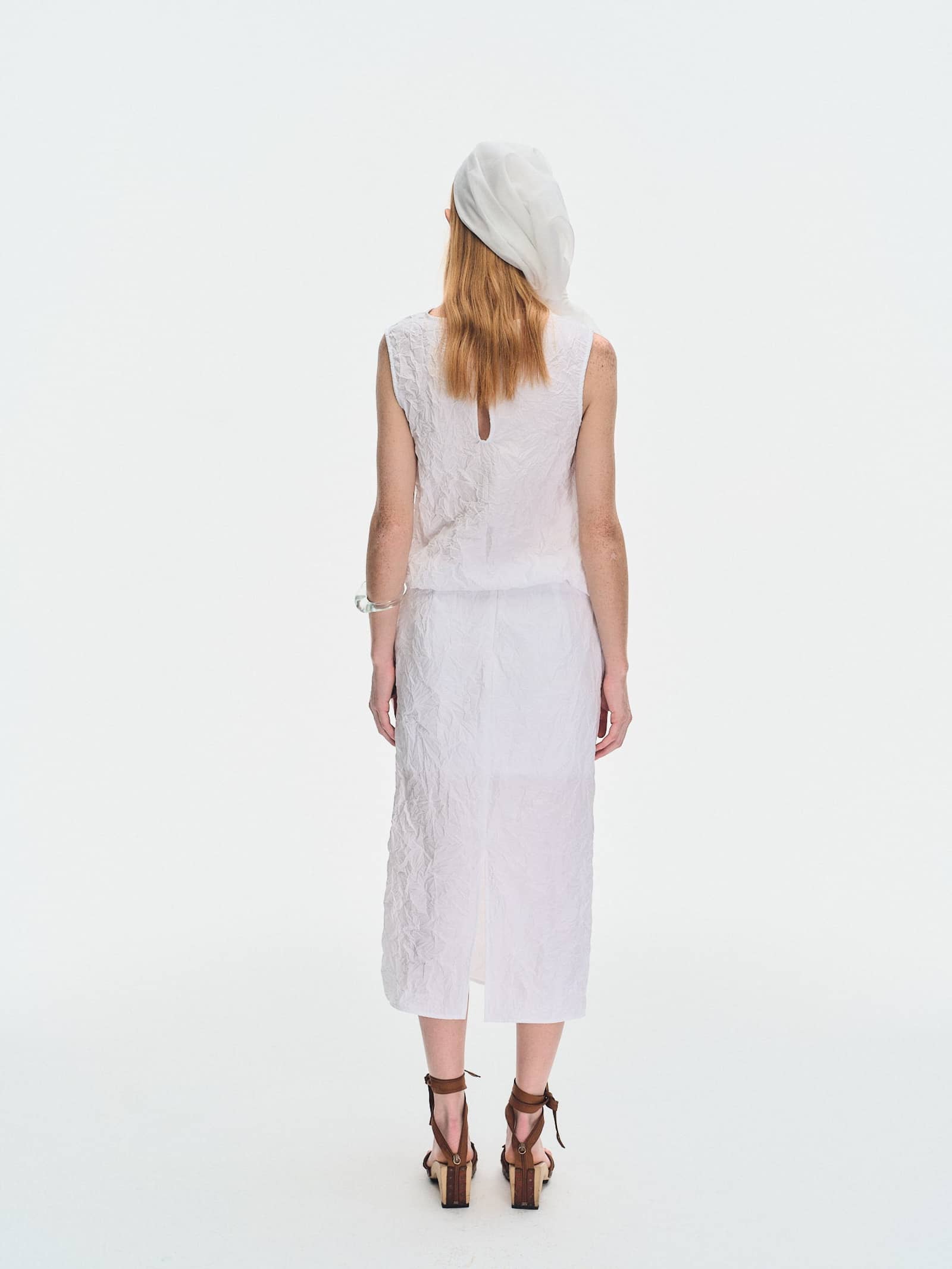 WHITE CRINKLED TEXTURE POLYESTER SLEEVELESS TOP made by YIBRI