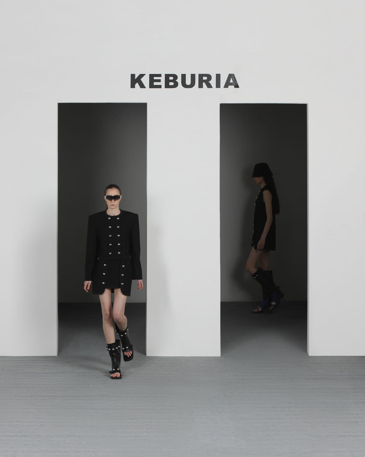 WOOL ASYMMETRIC MINI SKIRT in Black made by KEBURIA