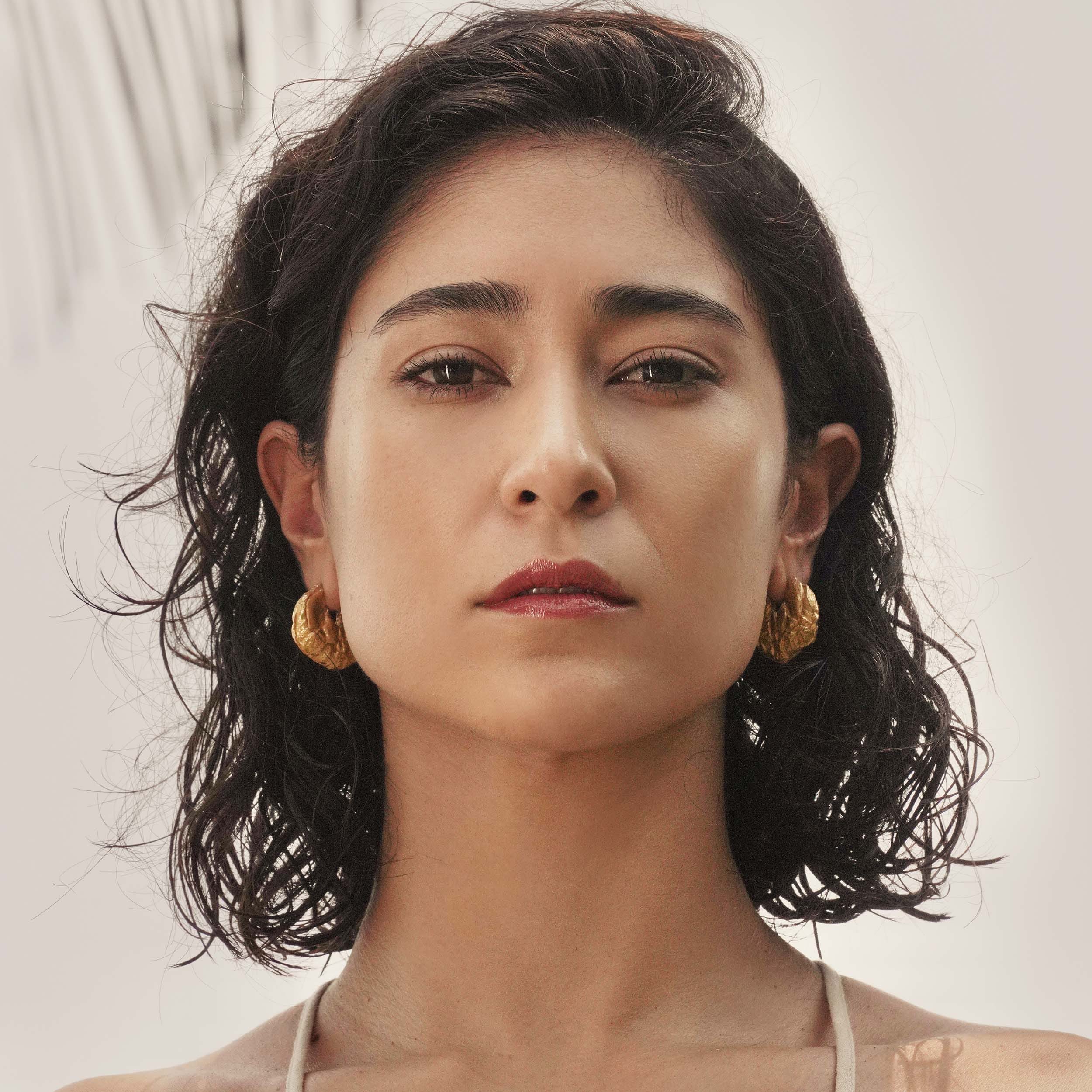 Poli White Sapphire Earrings made by Loveness Lee