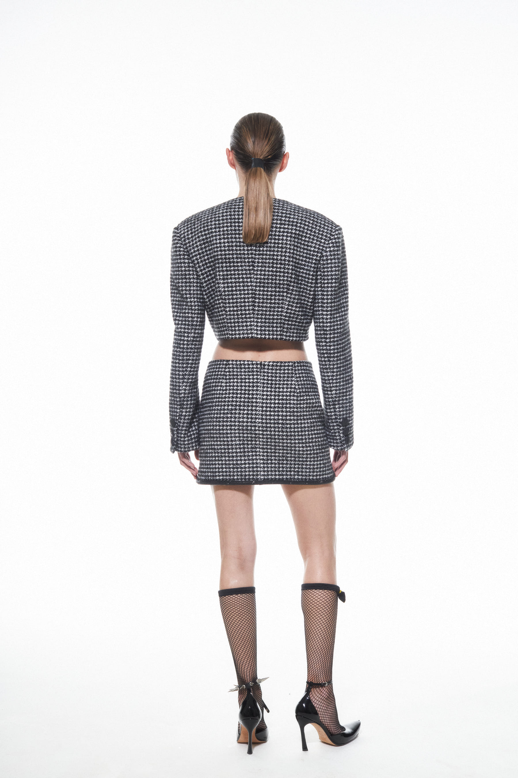 HOUNDSTOOTH SKIRT MINI in Black made by NUÉ