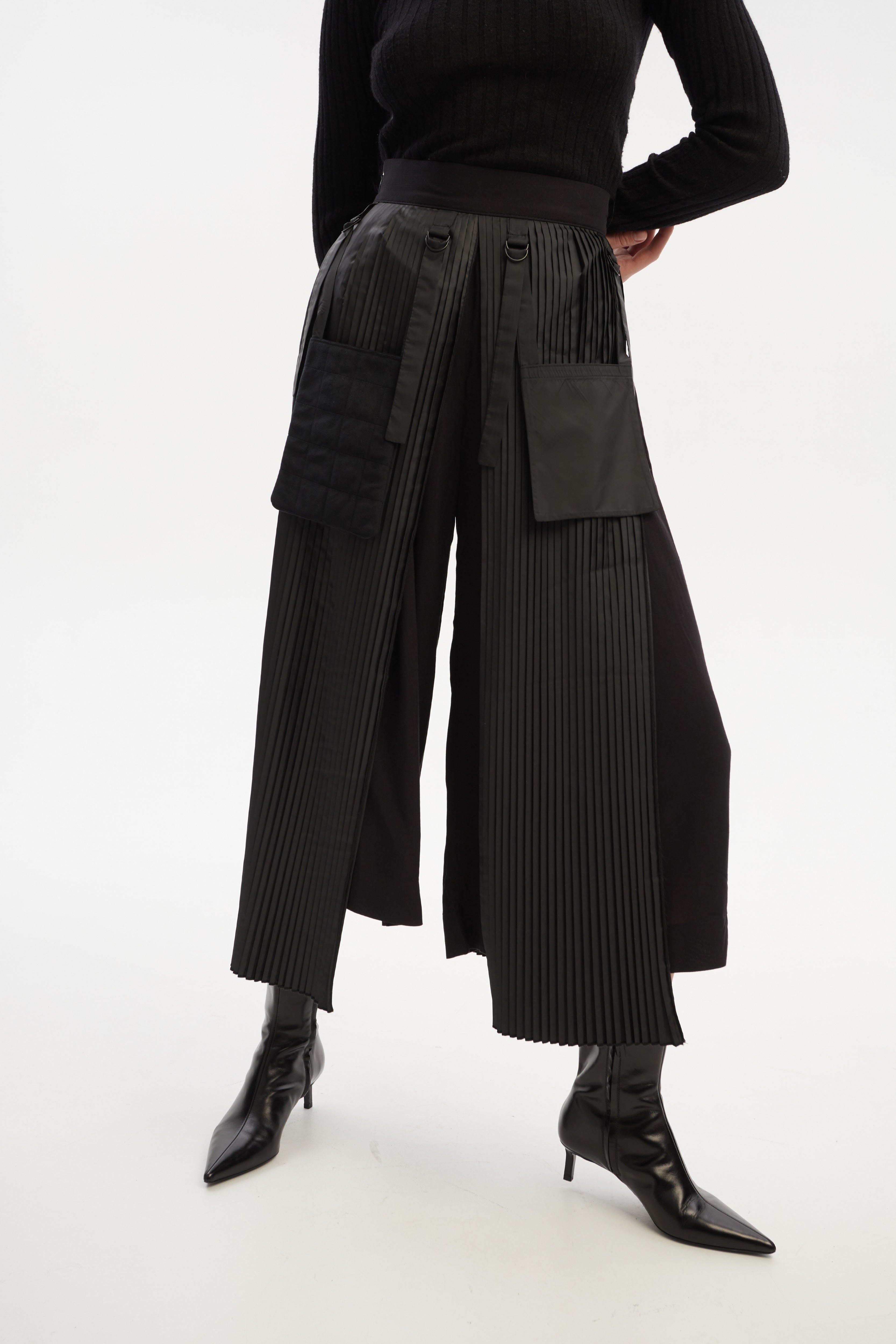 Culottes with pleated overwrap elements and detachable pockets made by Tamar Keburia