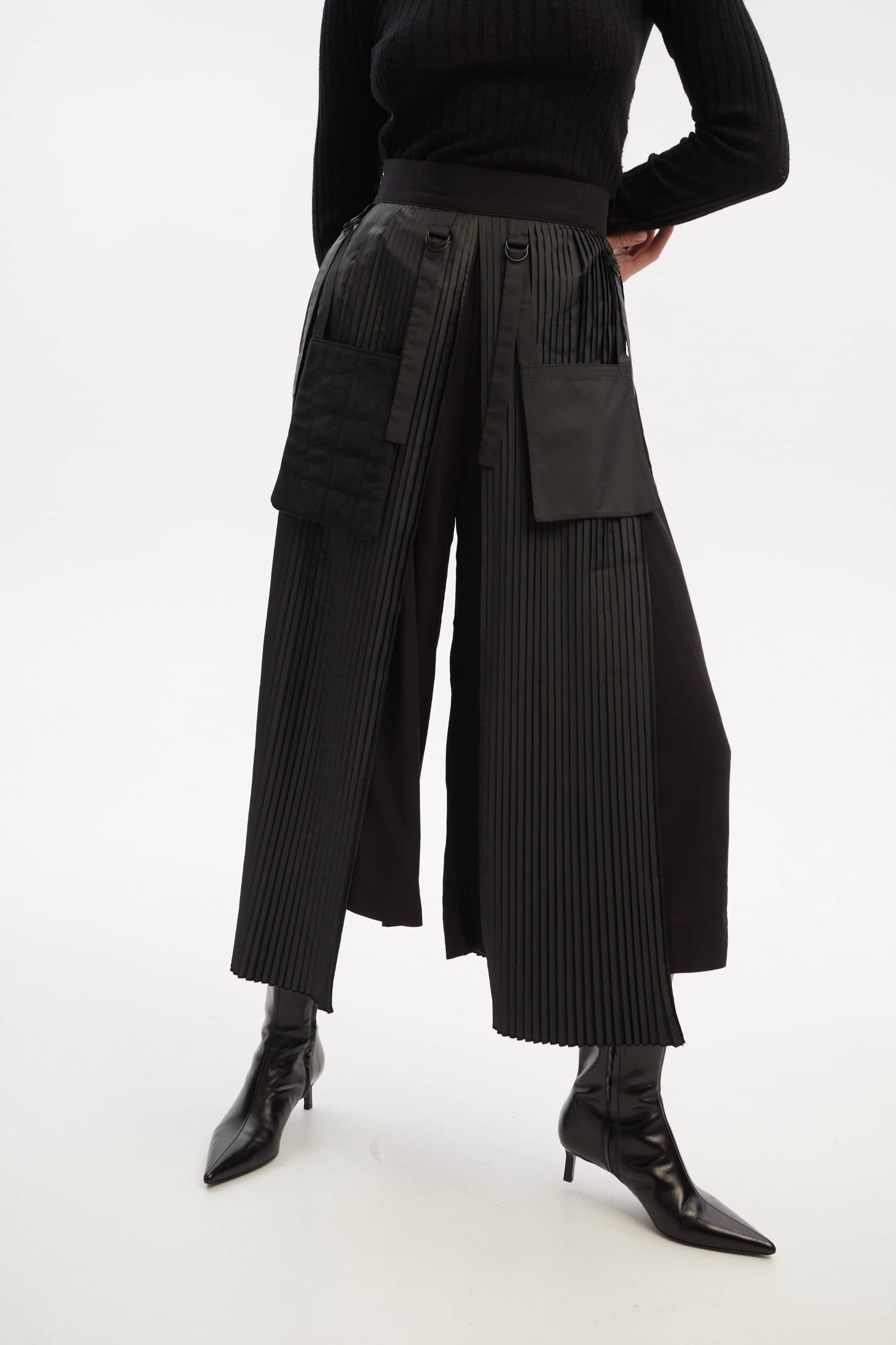 Culottes with pleated overwrap elements and detachable pockets made by Tamar Keburia