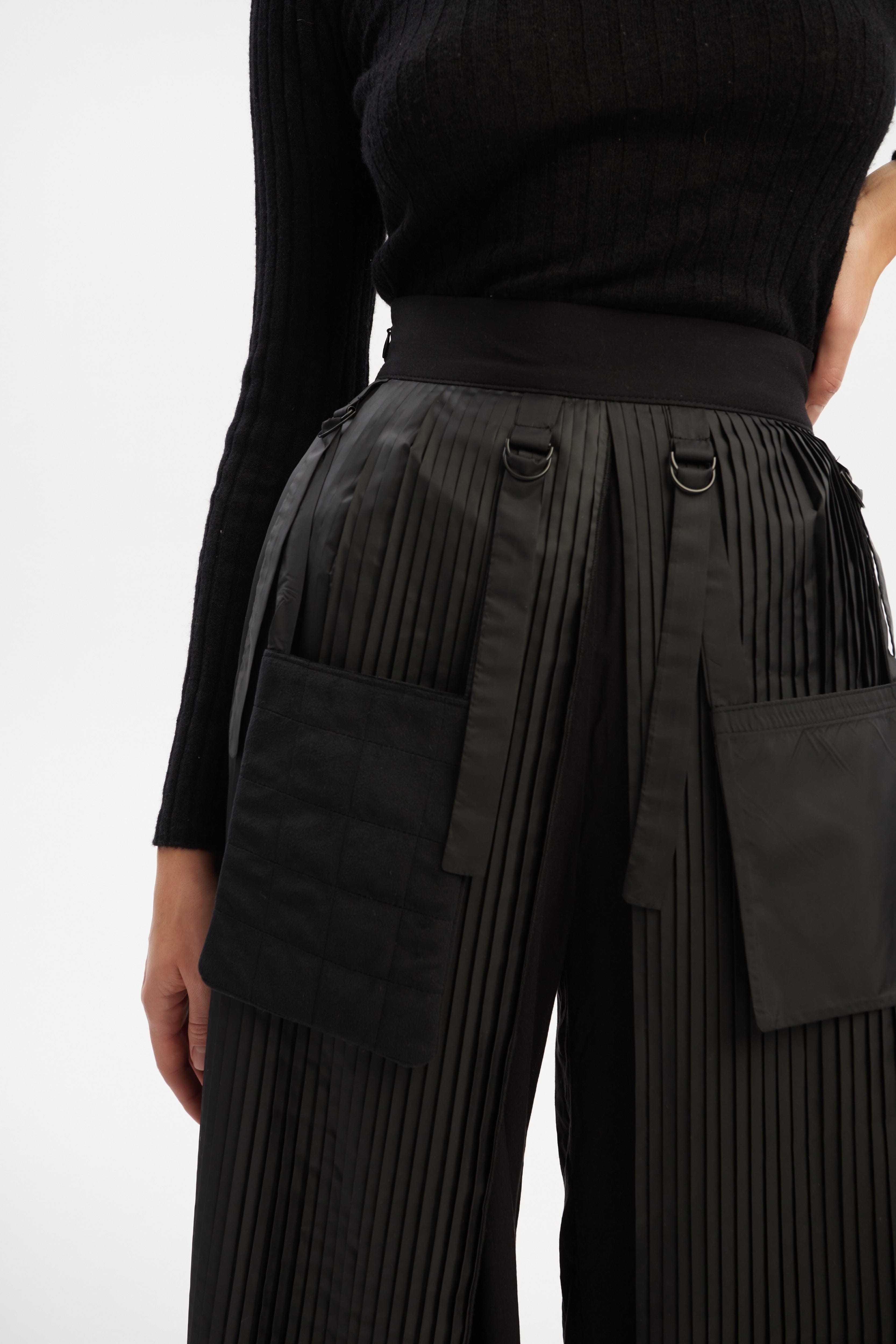 Culottes with pleated overwrap elements and detachable pockets made by Tamar Keburia