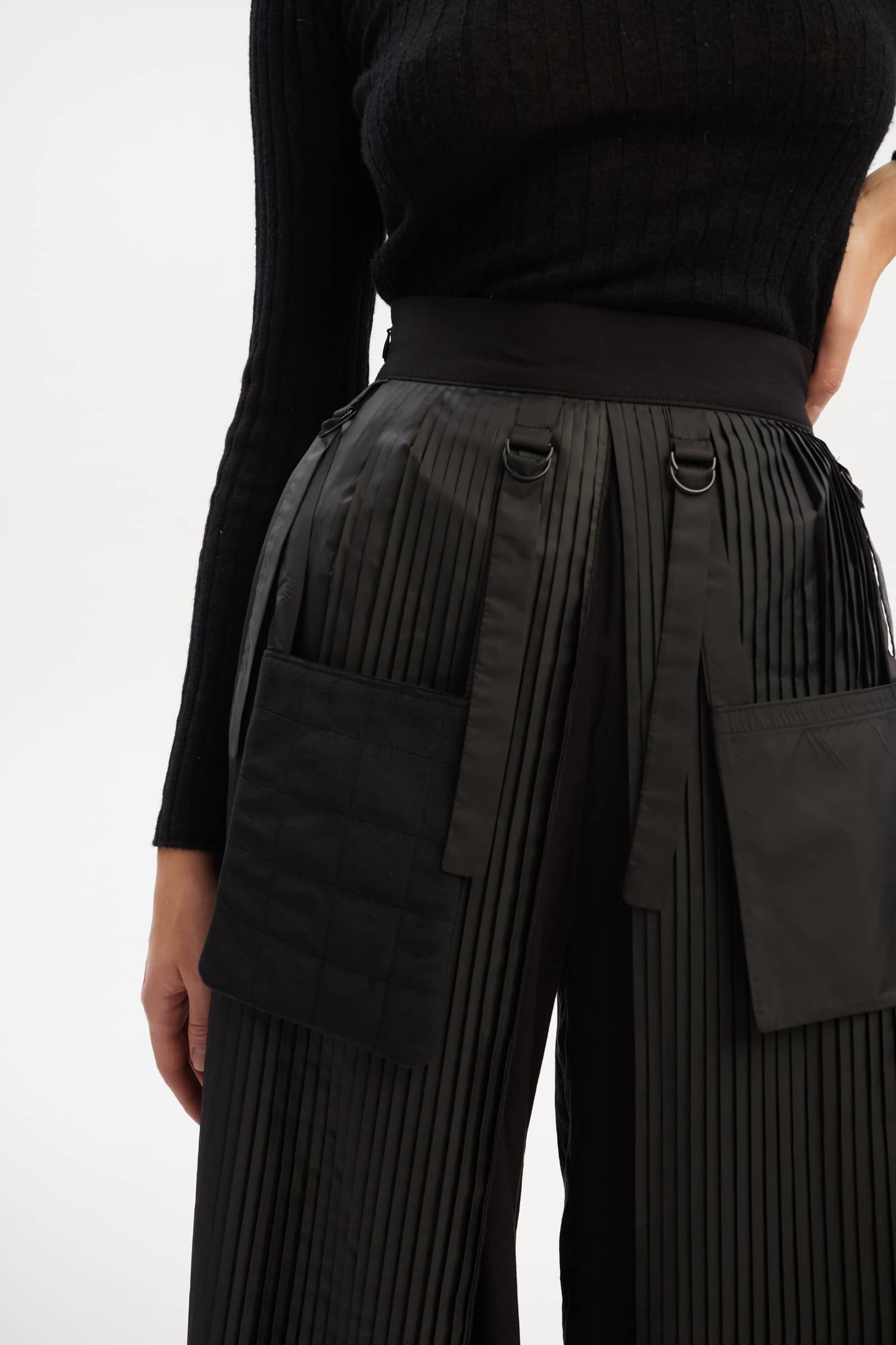 Culottes with pleated overwrap elements and detachable pockets made by Tamar Keburia