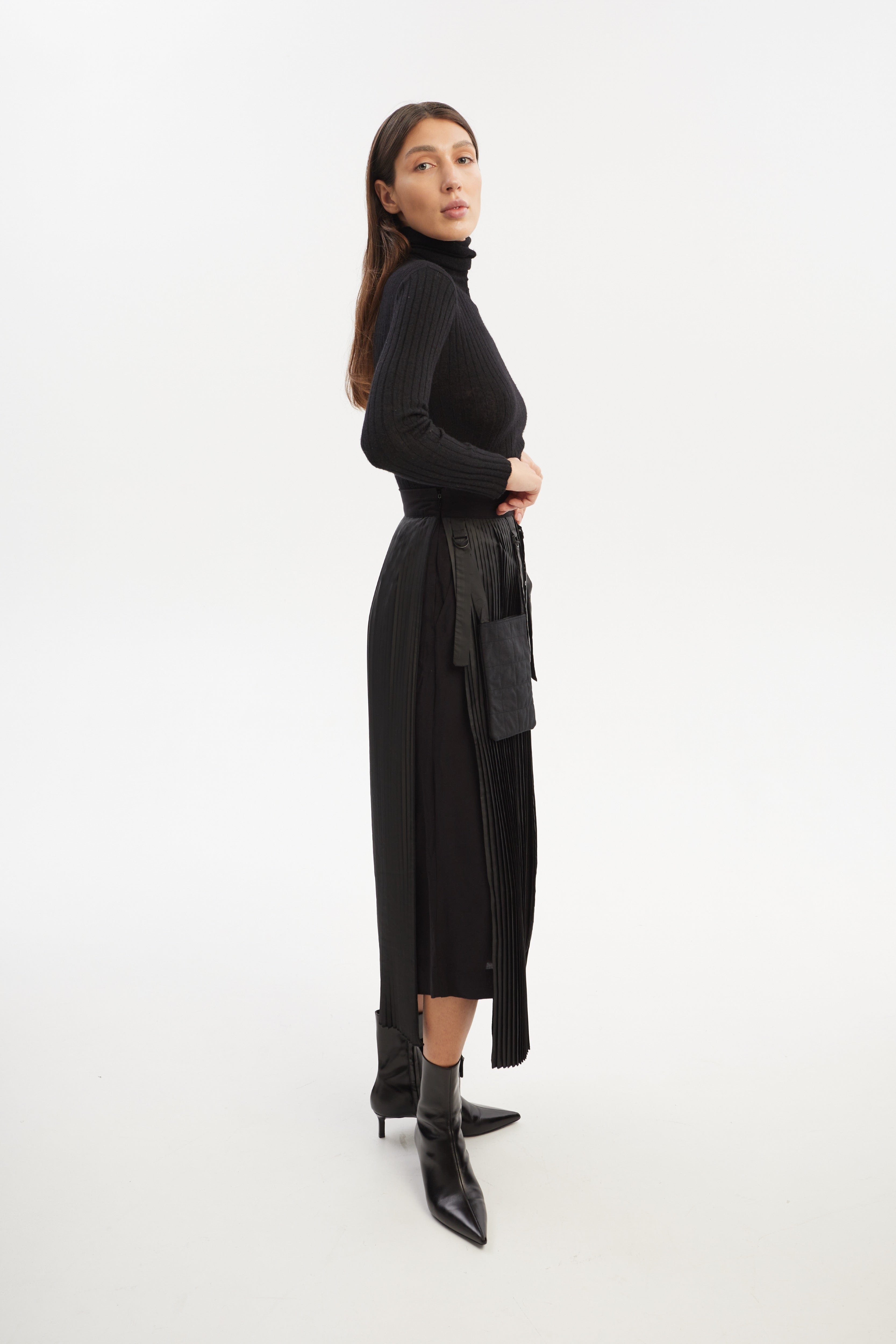 Culottes with pleated overwrap elements and detachable pockets made by Tamar Keburia