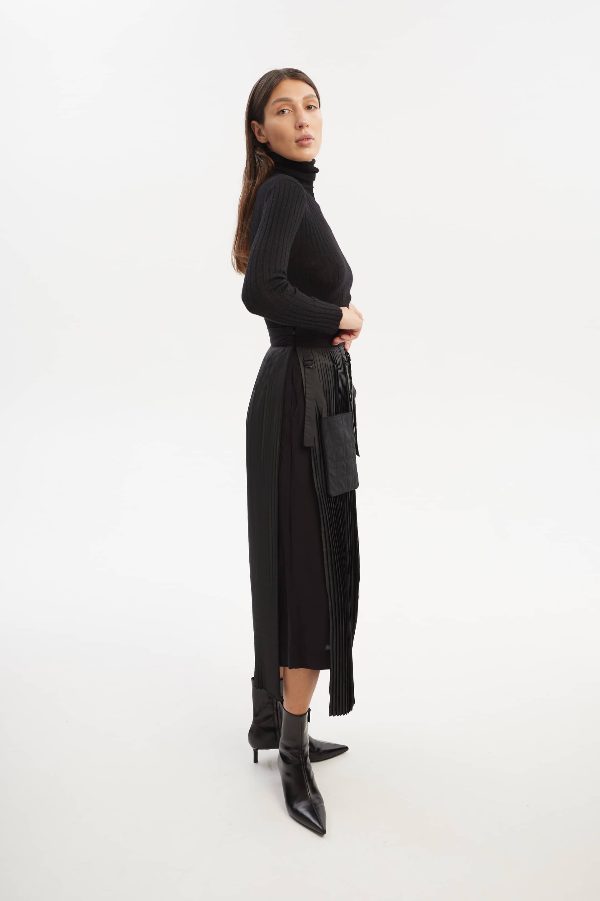 Culottes with pleated overwrap elements and detachable pockets made by Tamar Keburia