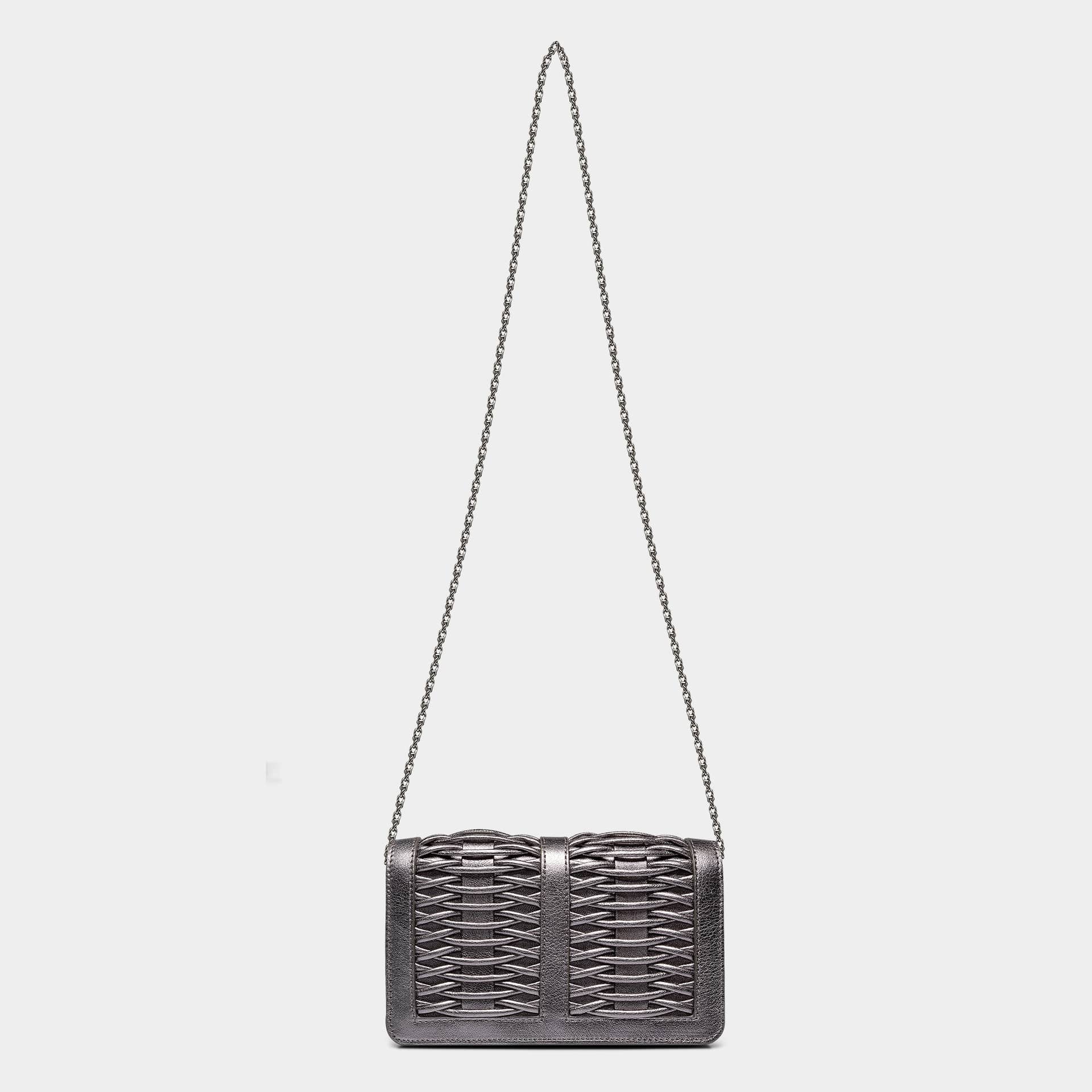 Lea pewter metallic braided clutch made by Yliana Yepez
