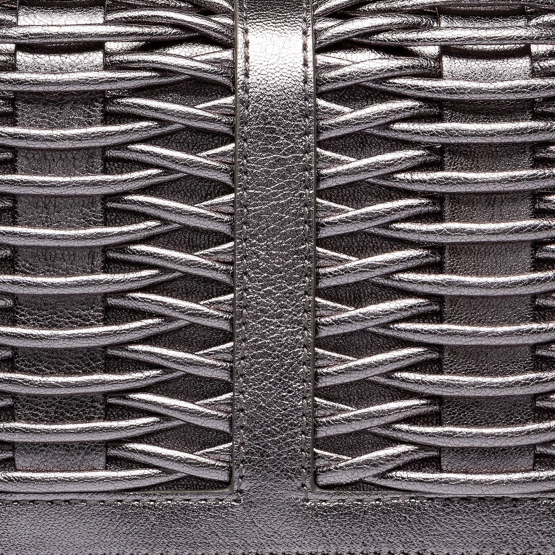 Lea pewter metallic braided clutch made by Yliana Yepez