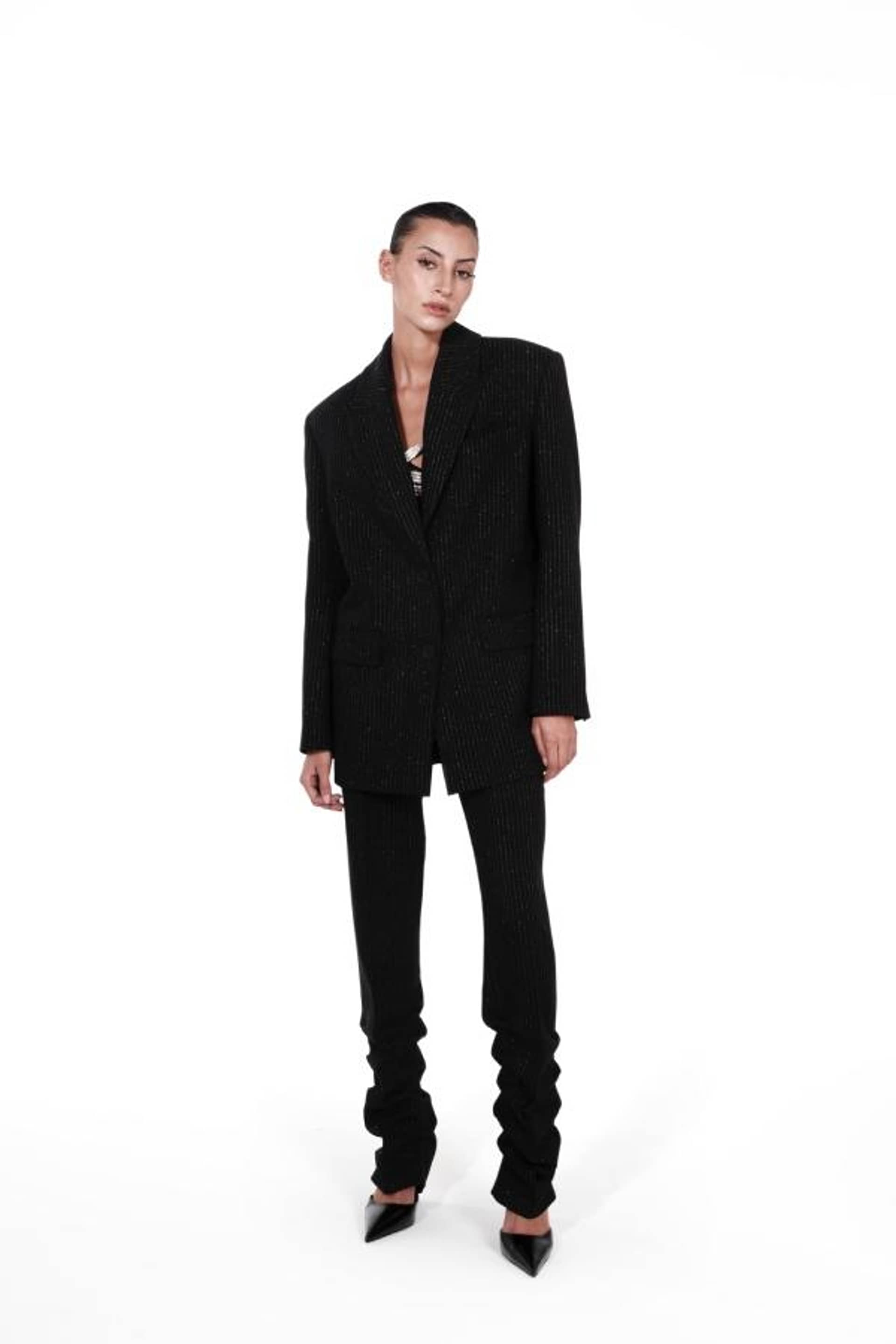 PINSTRIPED TROUSERS made by NUÉ