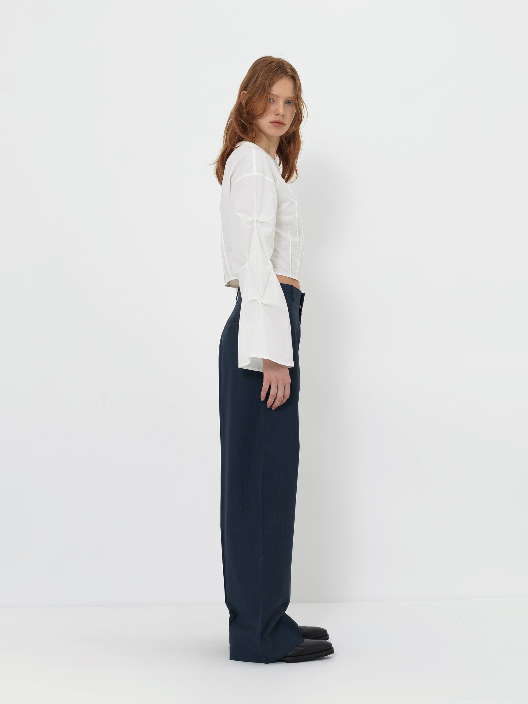 CROPPED WHITE BLOUSE WITH CROCHET FLOWER AND SMOCKED BELL SLEEVES made by YIBRI