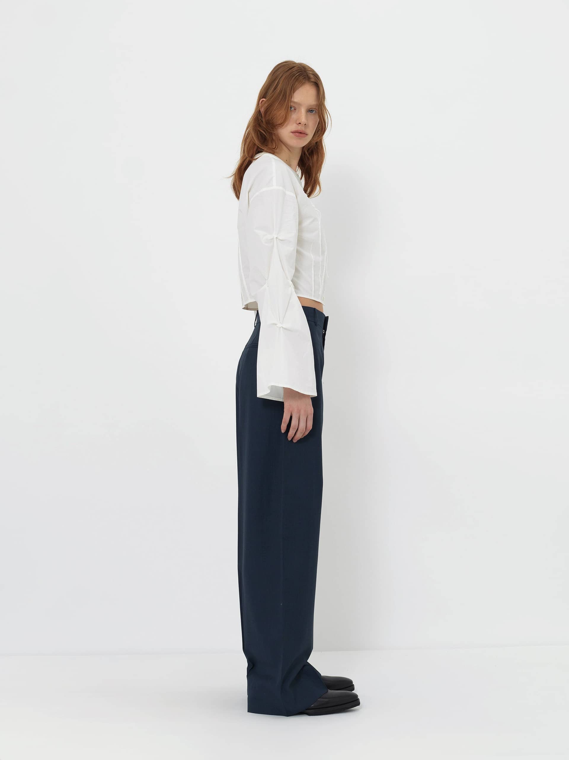 CROPPED WHITE BLOUSE WITH CROCHET FLOWER AND SMOCKED BELL SLEEVES made by YIBRI