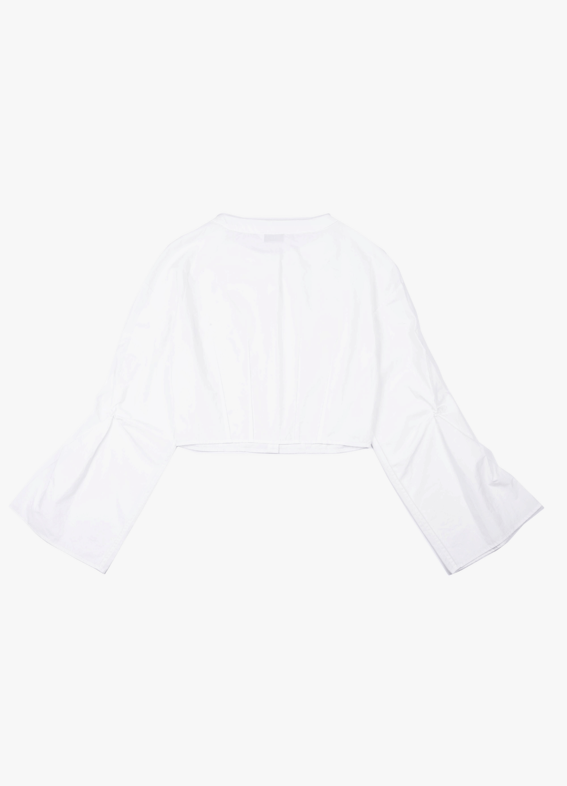 CROPPED WHITE BLOUSE WITH CROCHET FLOWER AND SMOCKED BELL SLEEVES made by YIBRI