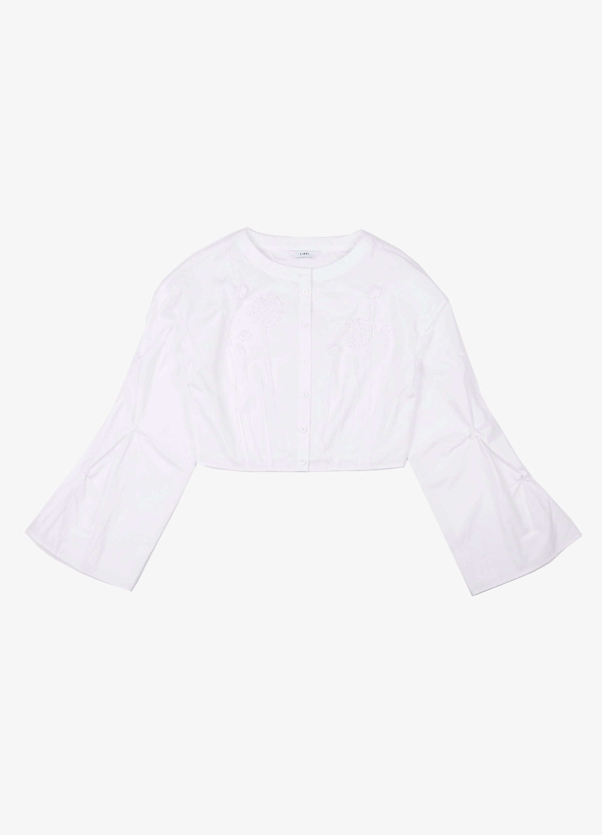 CROPPED WHITE BLOUSE WITH CROCHET FLOWER AND SMOCKED BELL SLEEVES made by YIBRI
