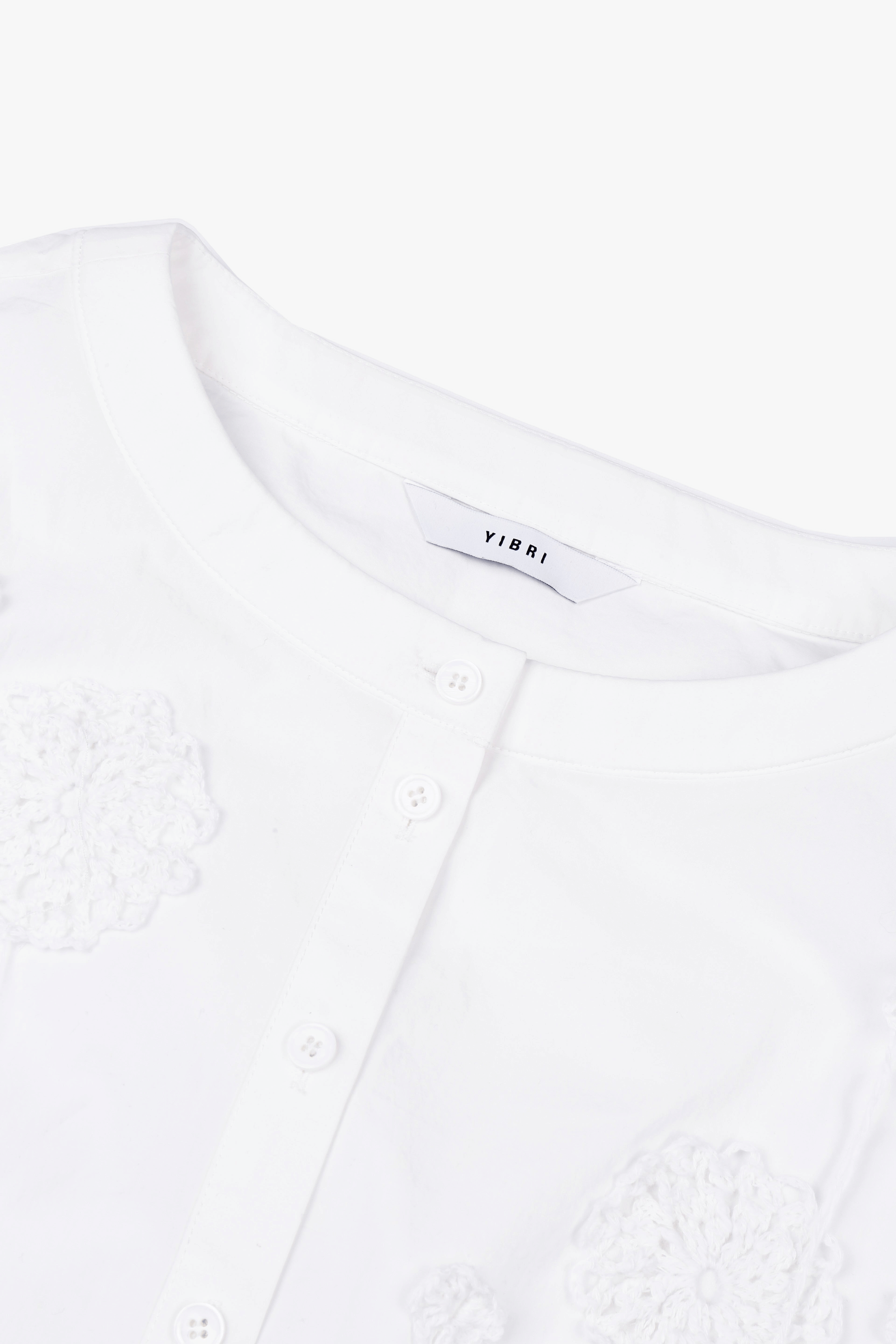 CROPPED WHITE BLOUSE WITH CROCHET FLOWER AND SMOCKED BELL SLEEVES made by YIBRI