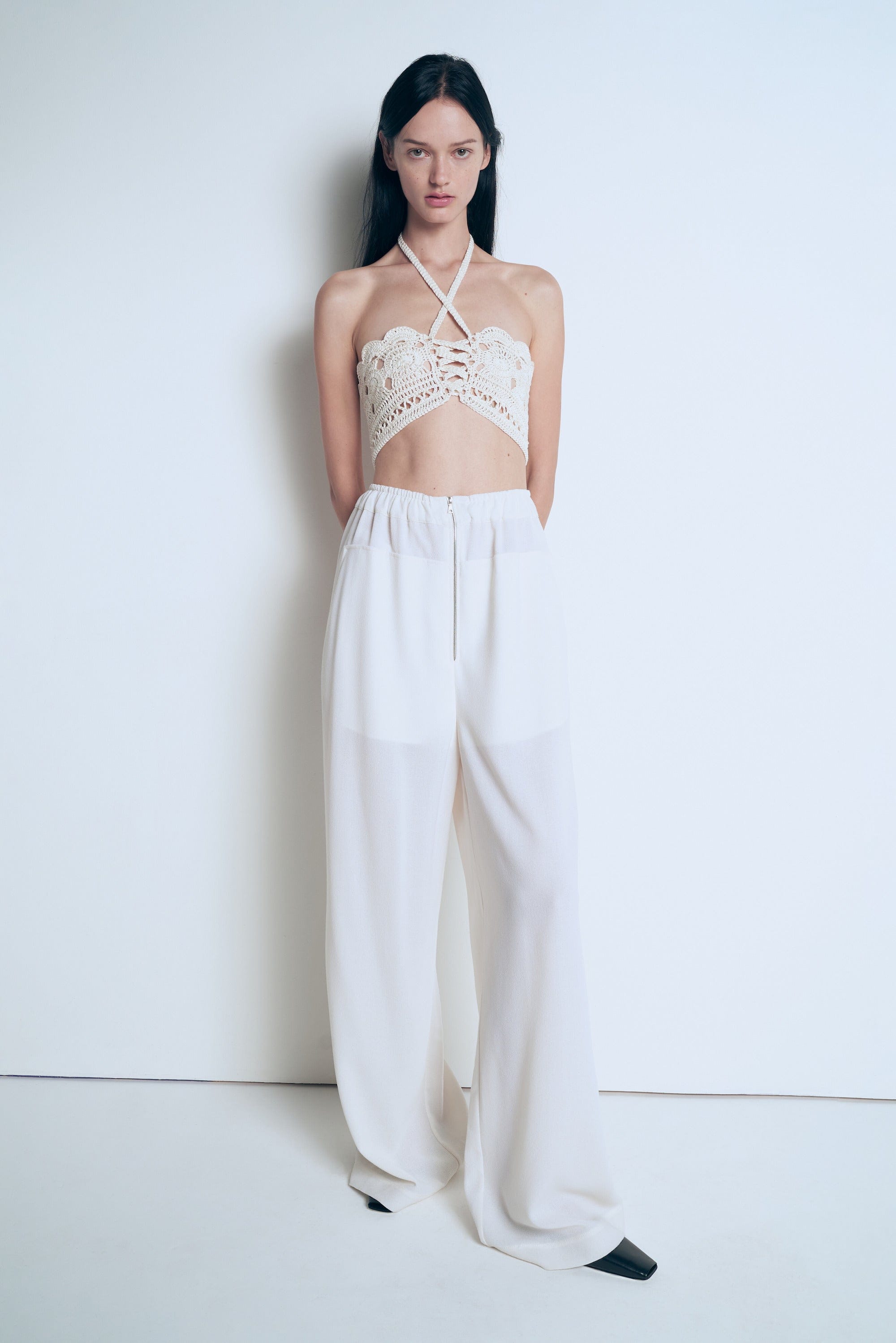 Knitted white top made by A.M.G