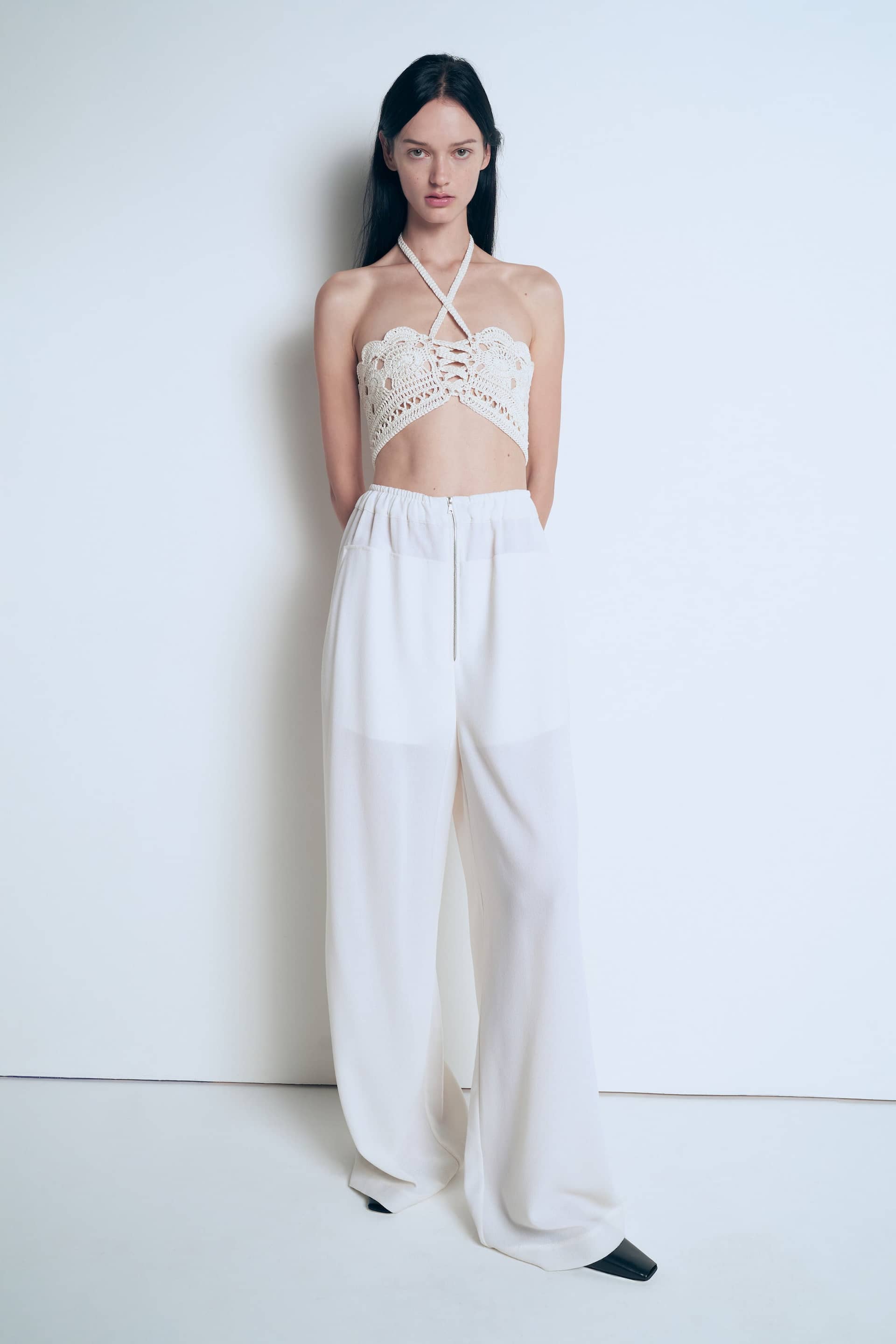 Knitted white top made by A.M.G