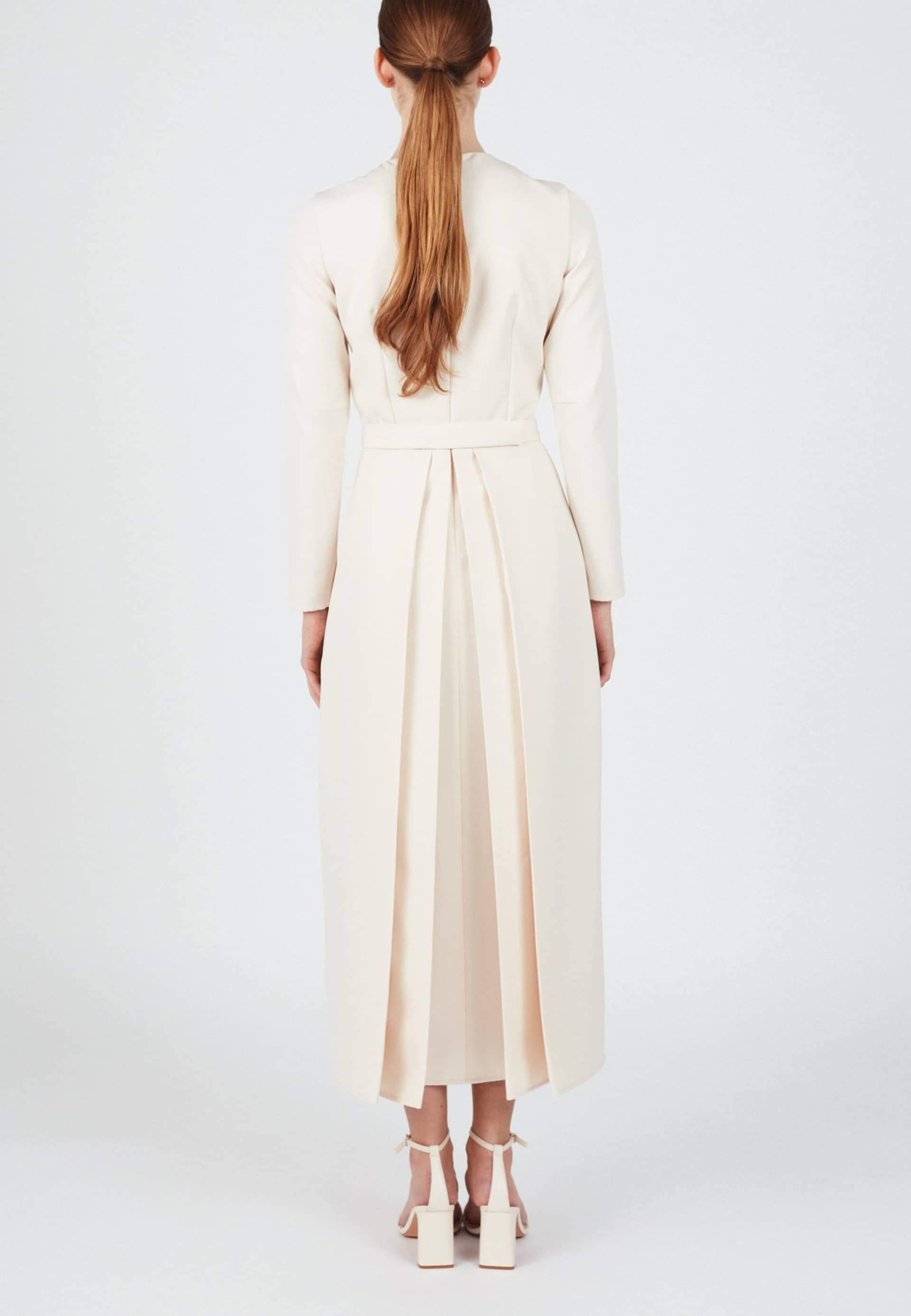 TILDA pastel cream classic pleated midi dress in White made by UNDRESS