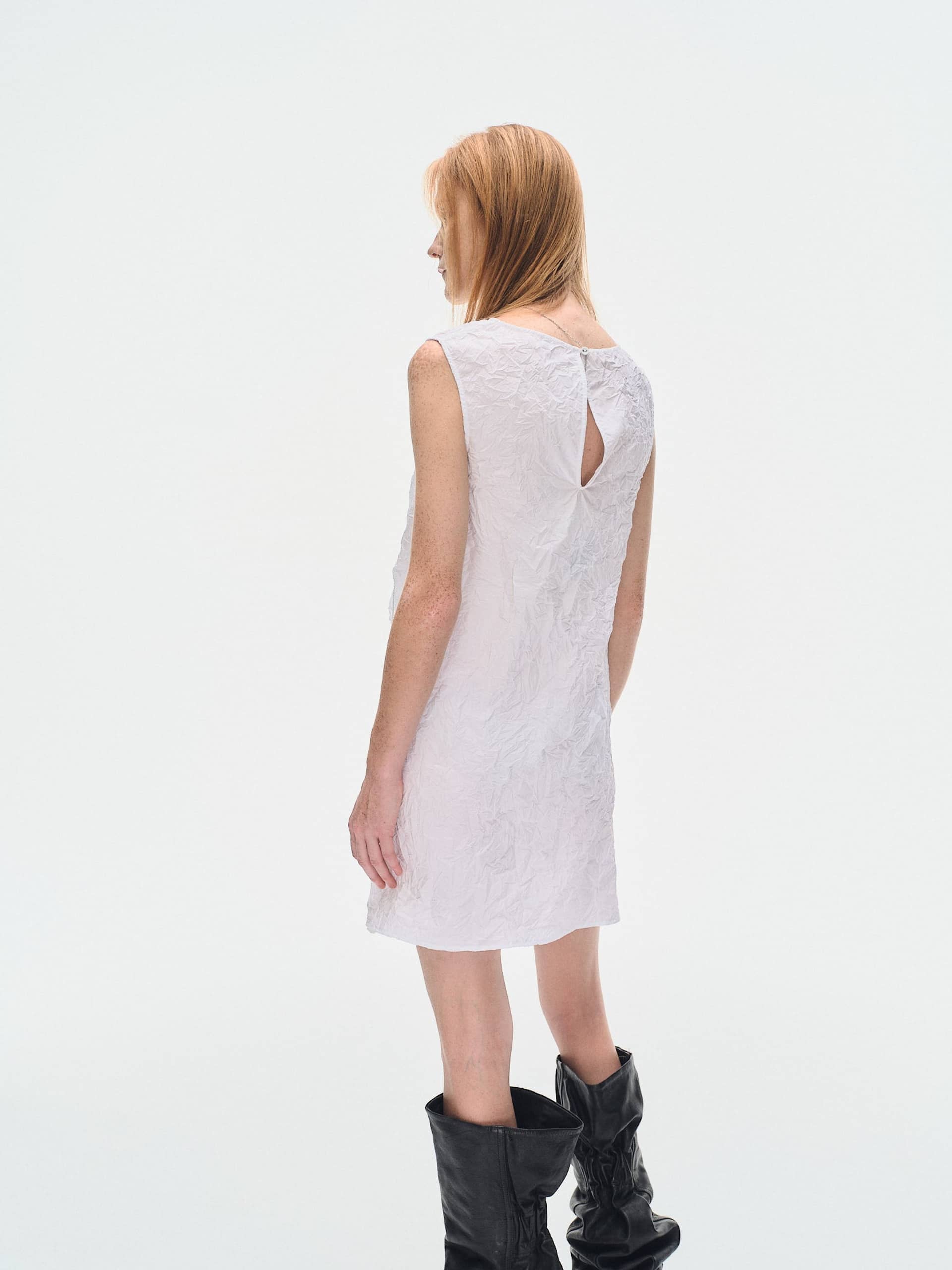 WHITE TEXTURED DRAPED MINI DRES made by YIBRI