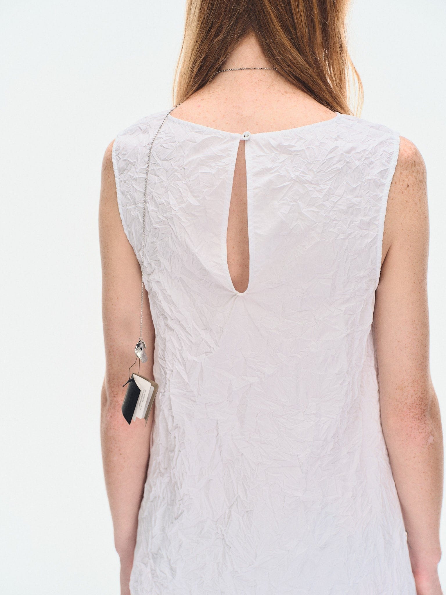 WHITE TEXTURED DRAPED MINI DRES made by YIBRI