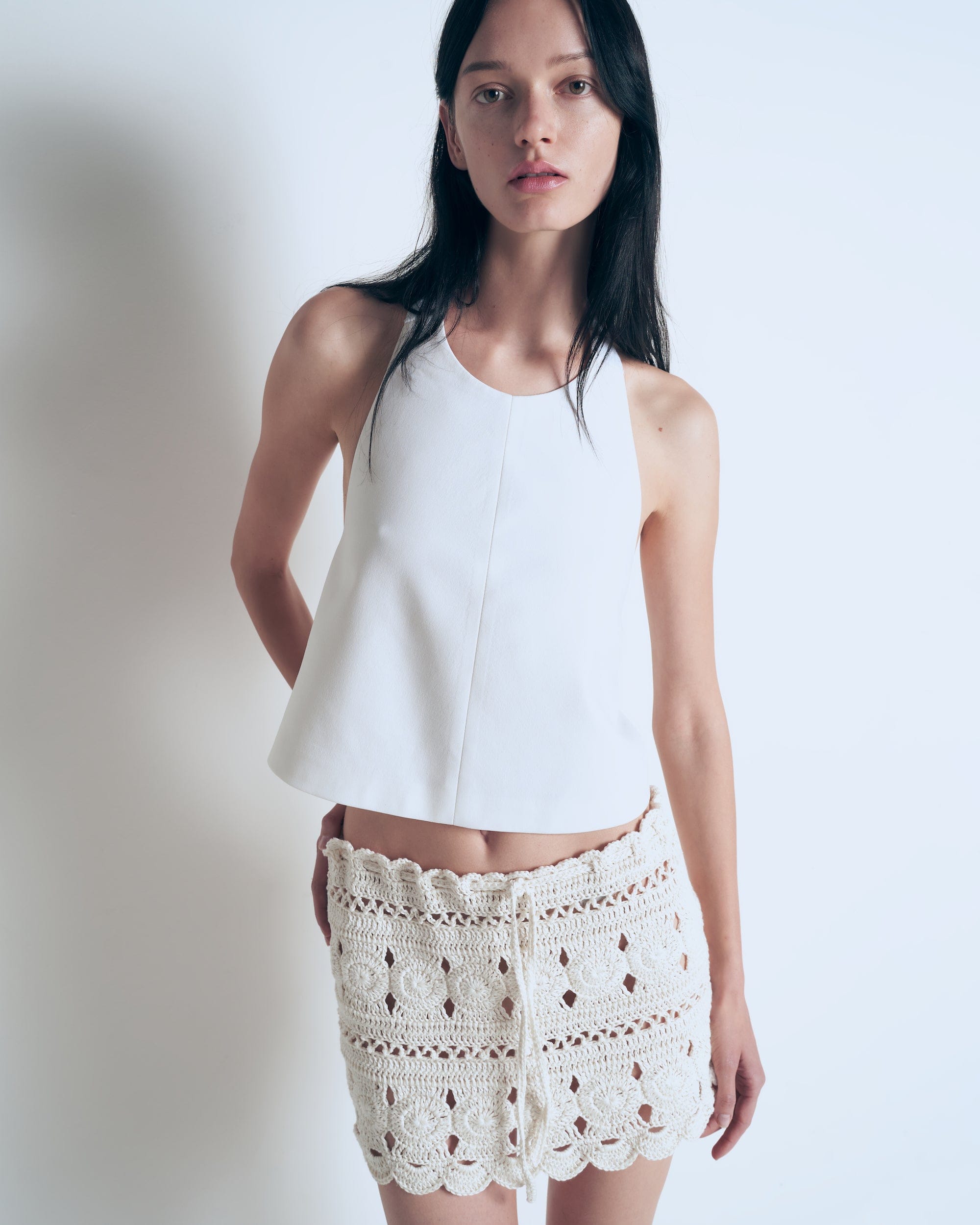 White tie top with buckle made by A.M.G