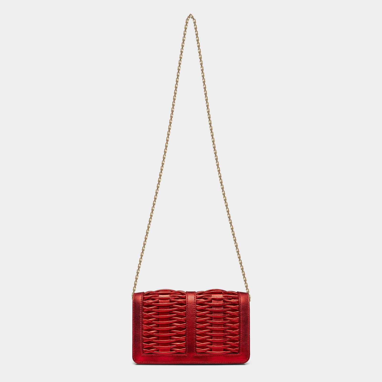 Lea red metallic braided clutch made by Yliana Yepez