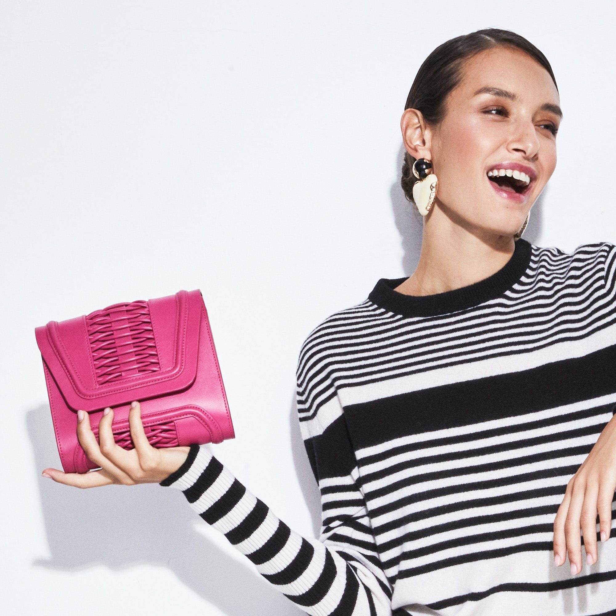 Mini Giovanna fuchsia braided clutch made by Yliana Yepez