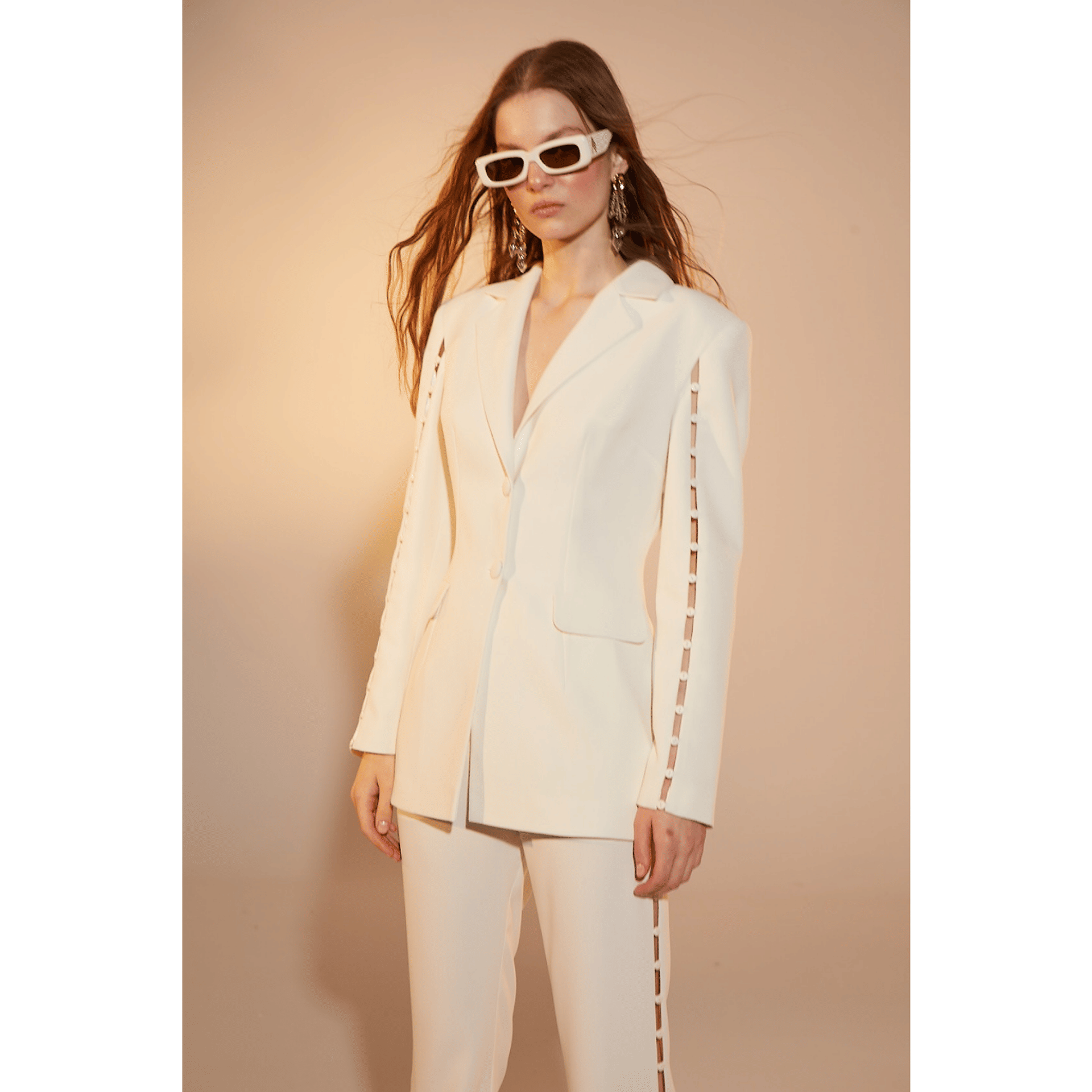 Marylebone Crepe Flared Trousers in Vanilla Ice in White made by Nazli Ceren