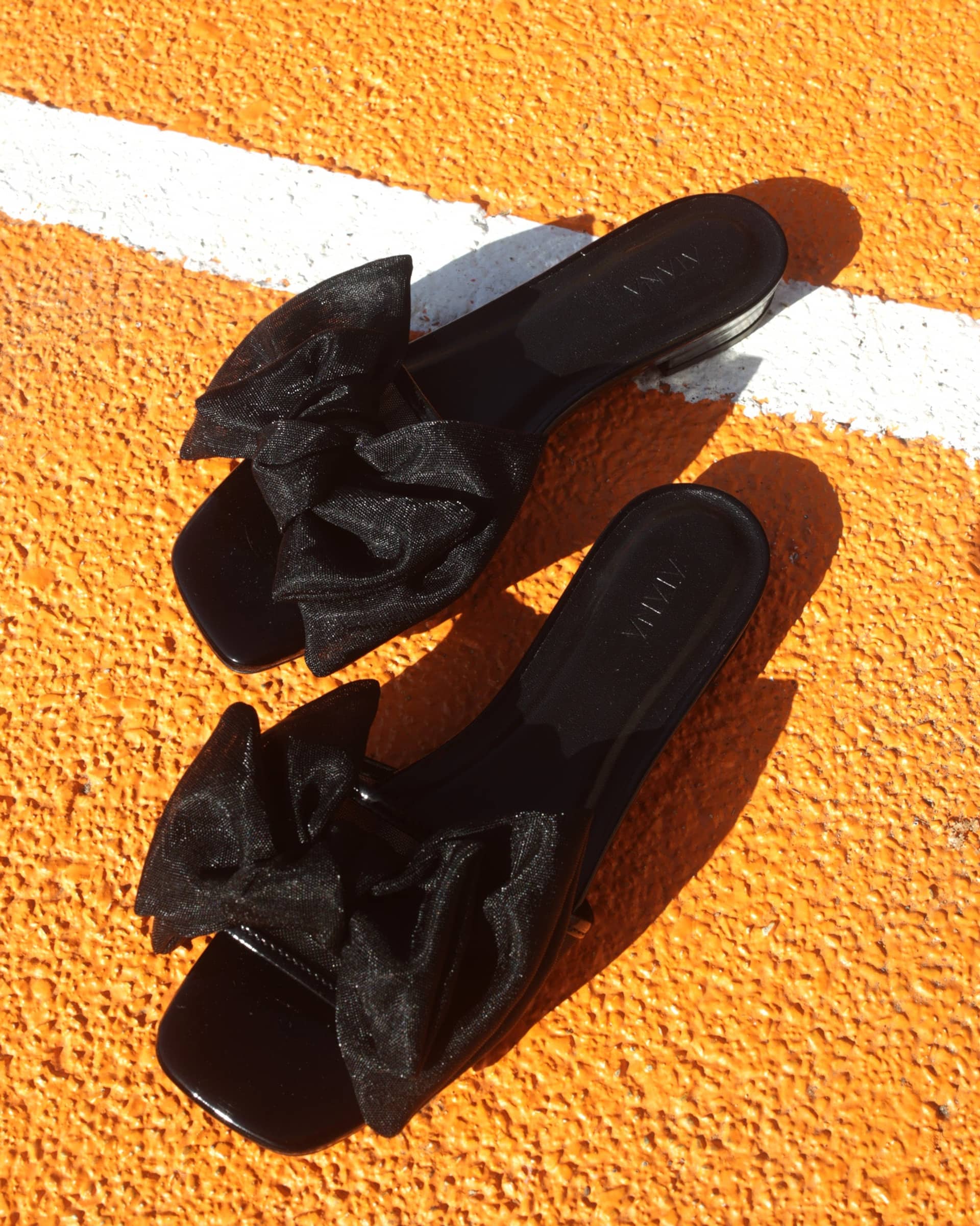 Bow Slide Black Patent in Black made by ATANA