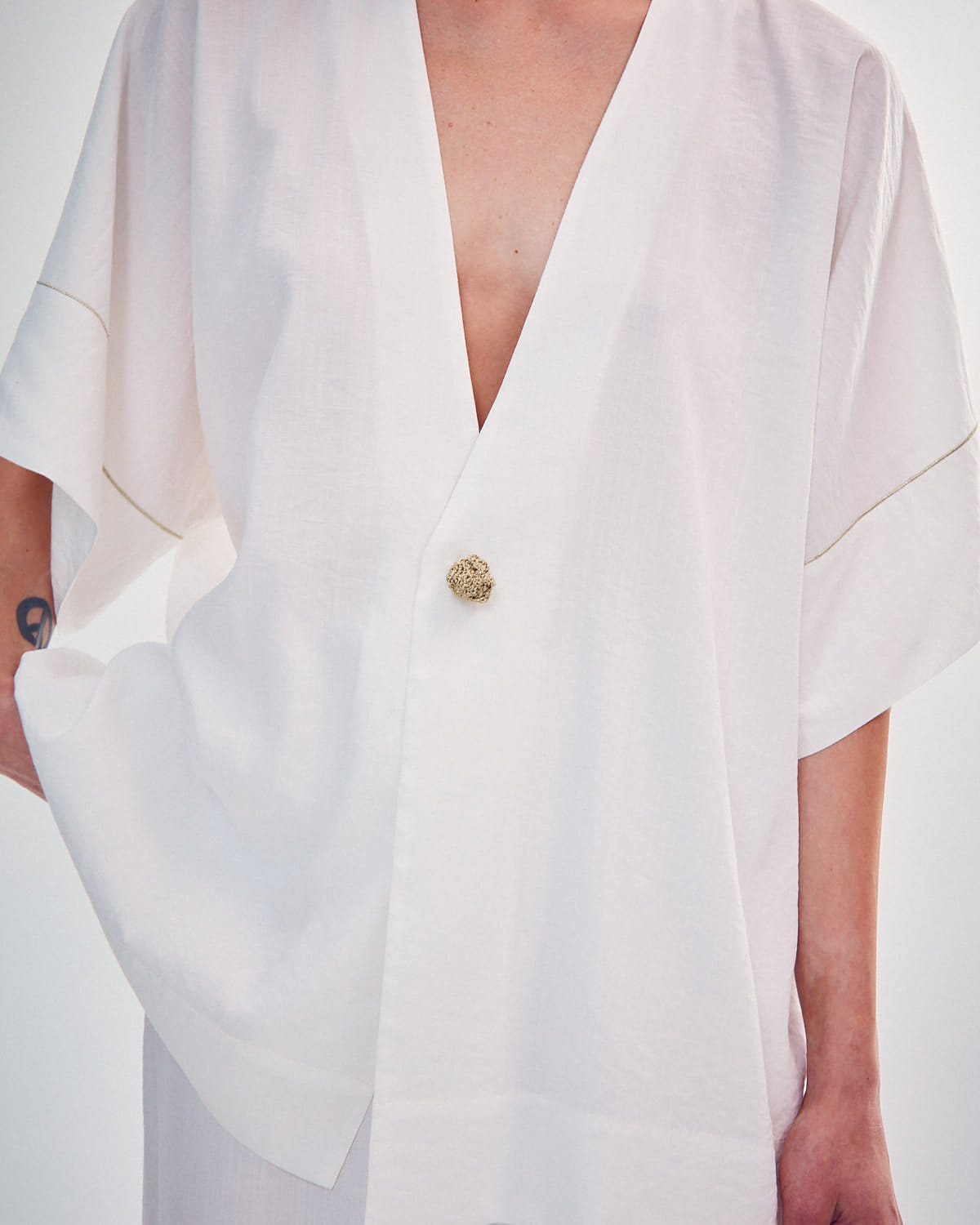 SHIRT WITH A KNITTED GOLD BUTTON made by DELEGAN Clothes