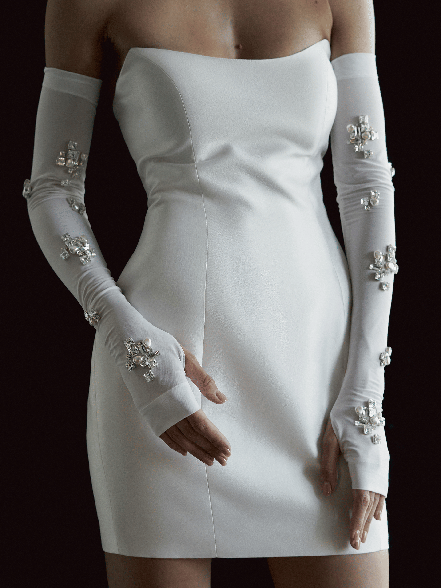 FINGERLESS GLOVES WITH JEWEL AND PEARL EMBELLISHMENTS in White made by NDS The Label