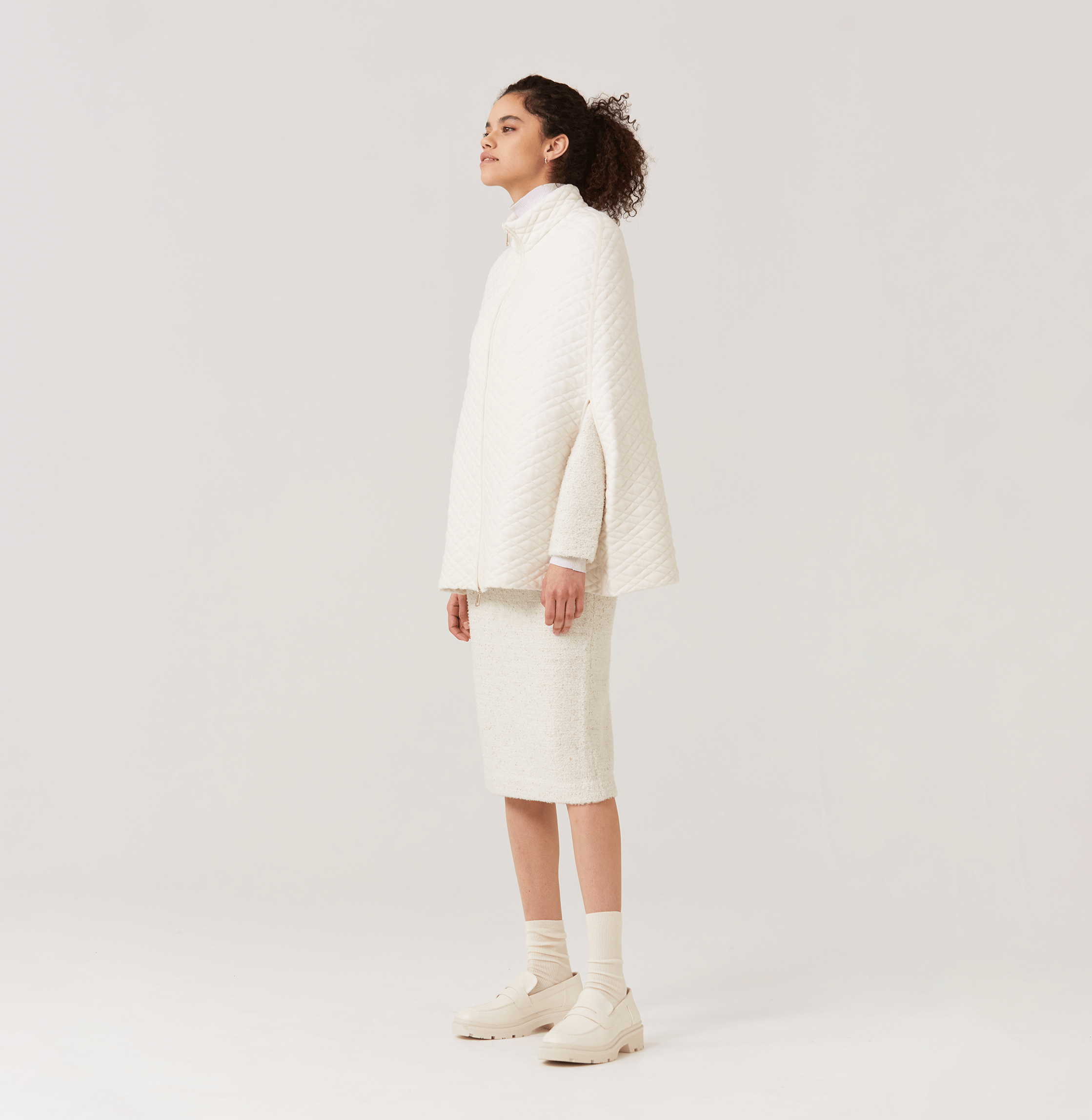 QUILTED-KNIT CAPE in White made by CRUSH Collection