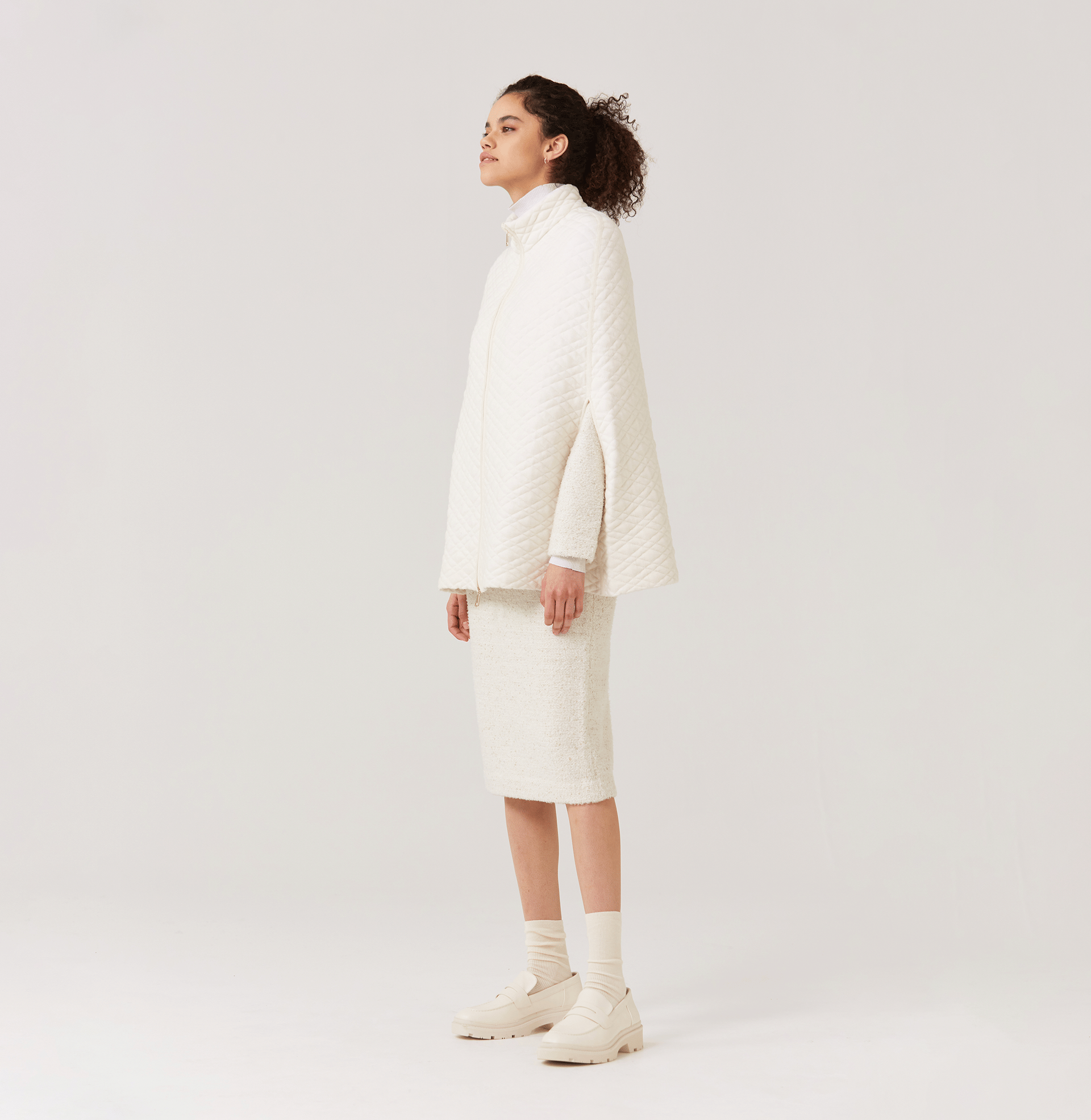 QUILTED-KNIT CAPE in White made by CRUSH Collection