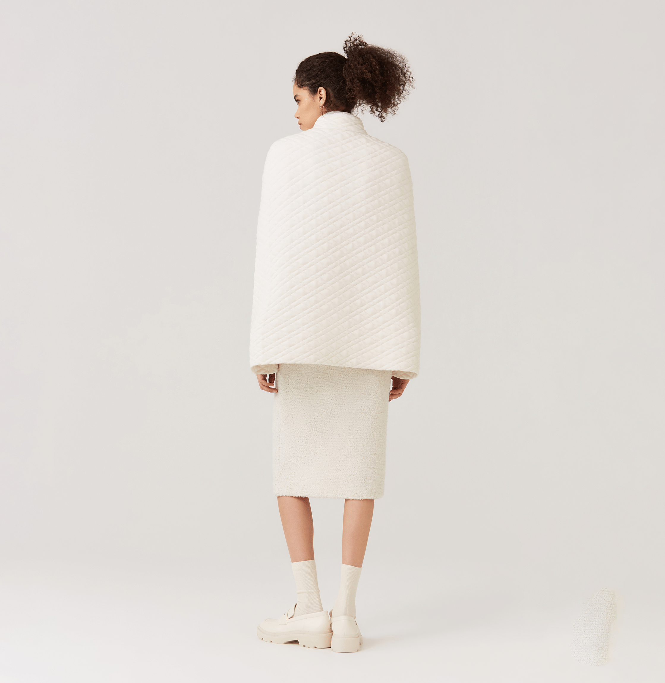 QUILTED-KNIT CAPE in White made by CRUSH Collection