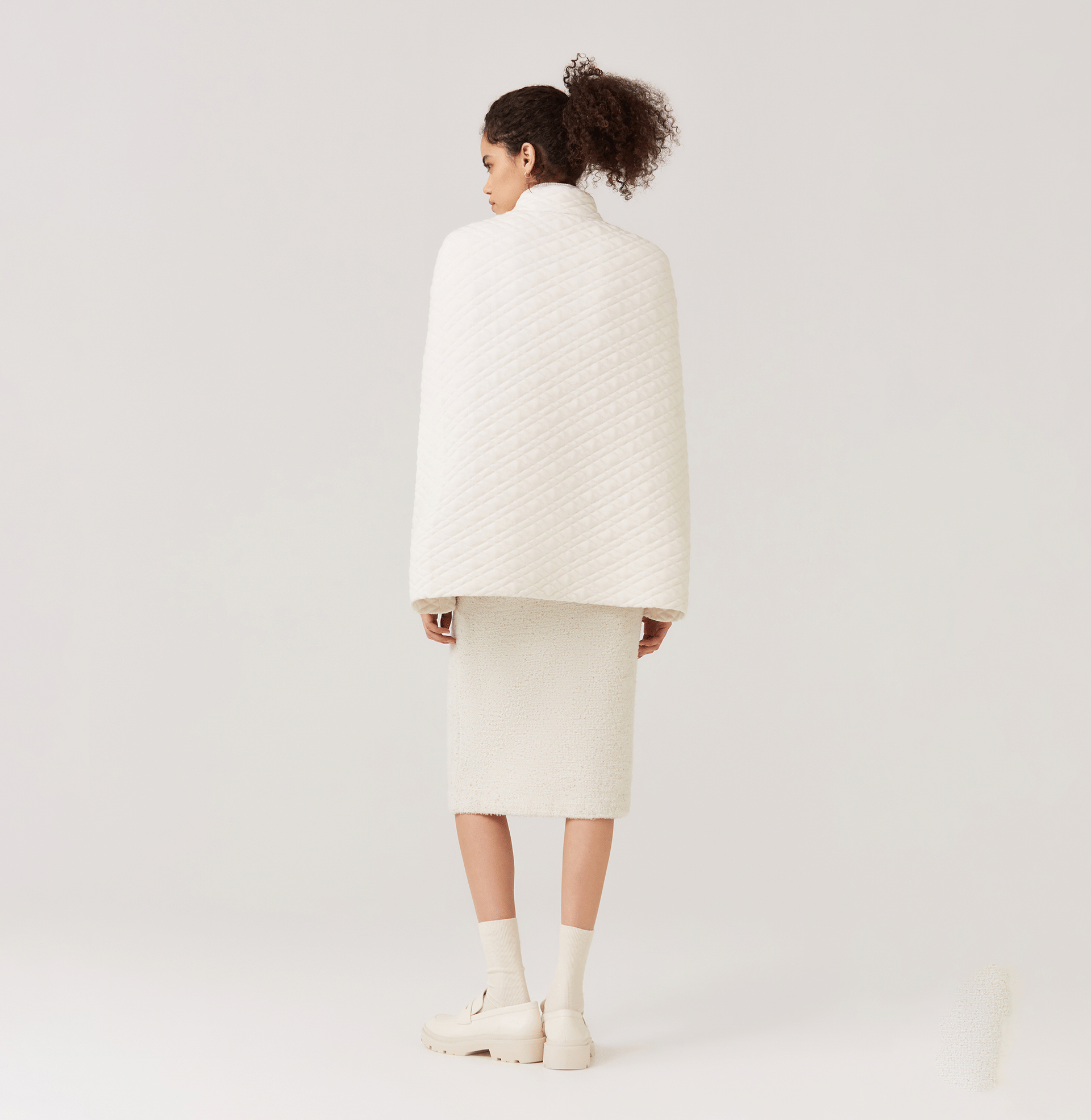 QUILTED-KNIT CAPE in White made by CRUSH Collection
