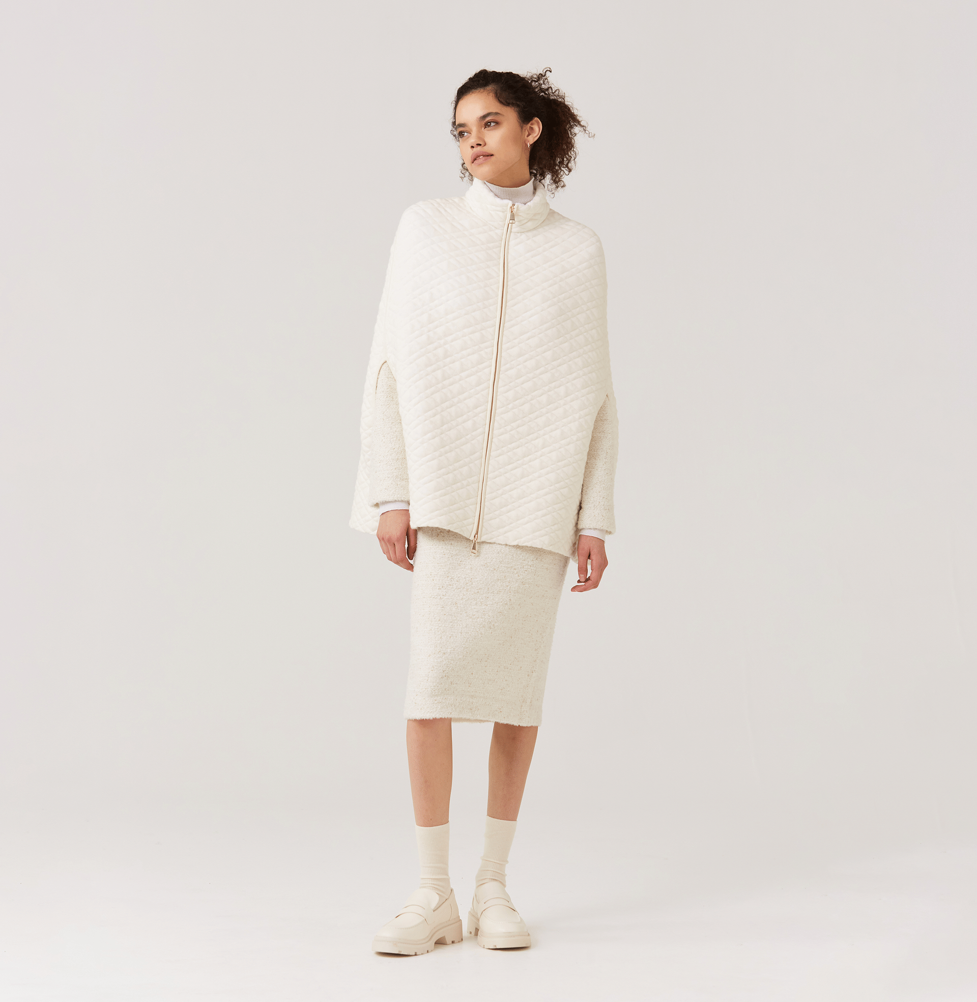 QUILTED-KNIT CAPE in White made by CRUSH Collection