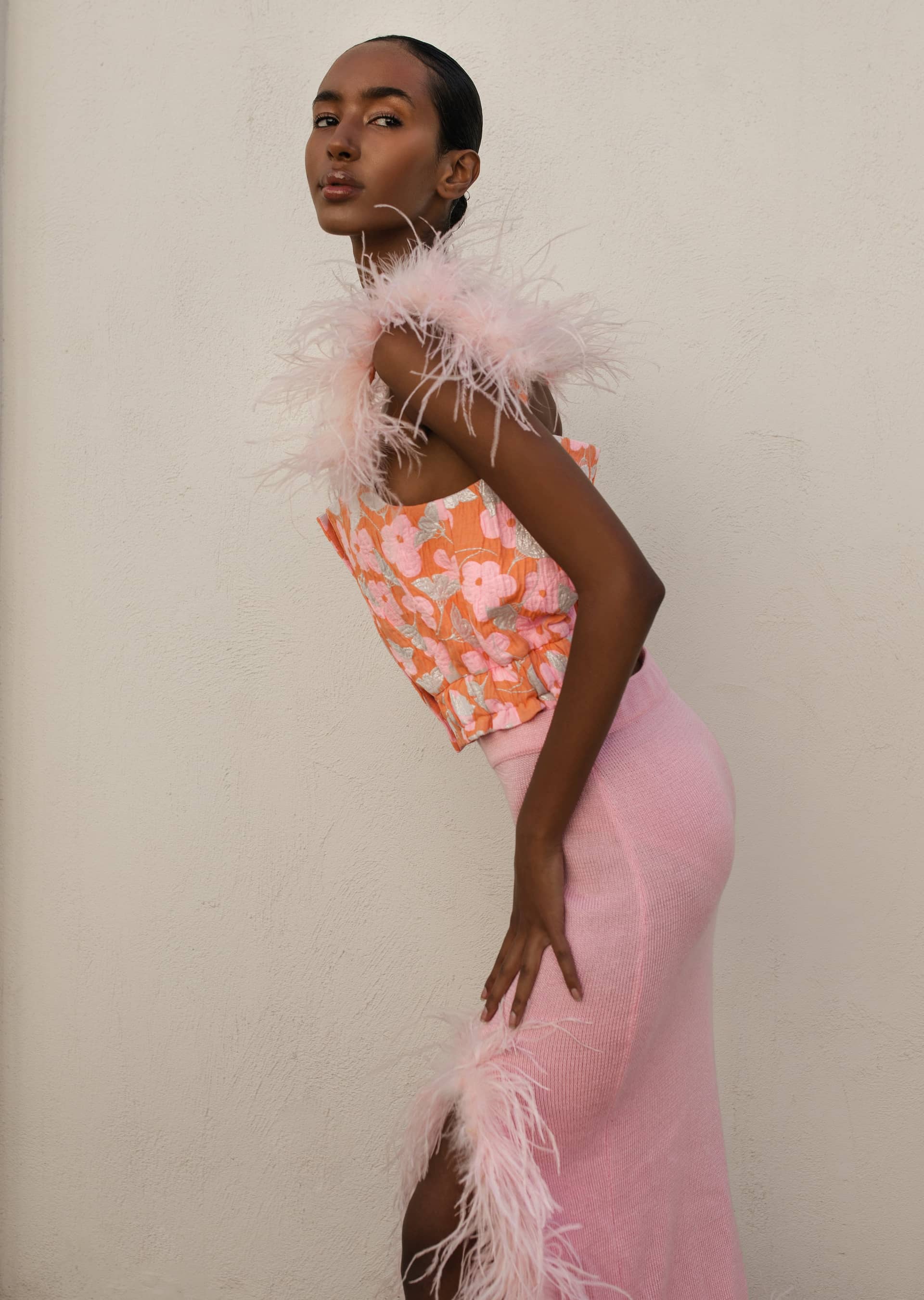 Pink flower top with feather details and pearl buttons in Pink made by ANDREEVA