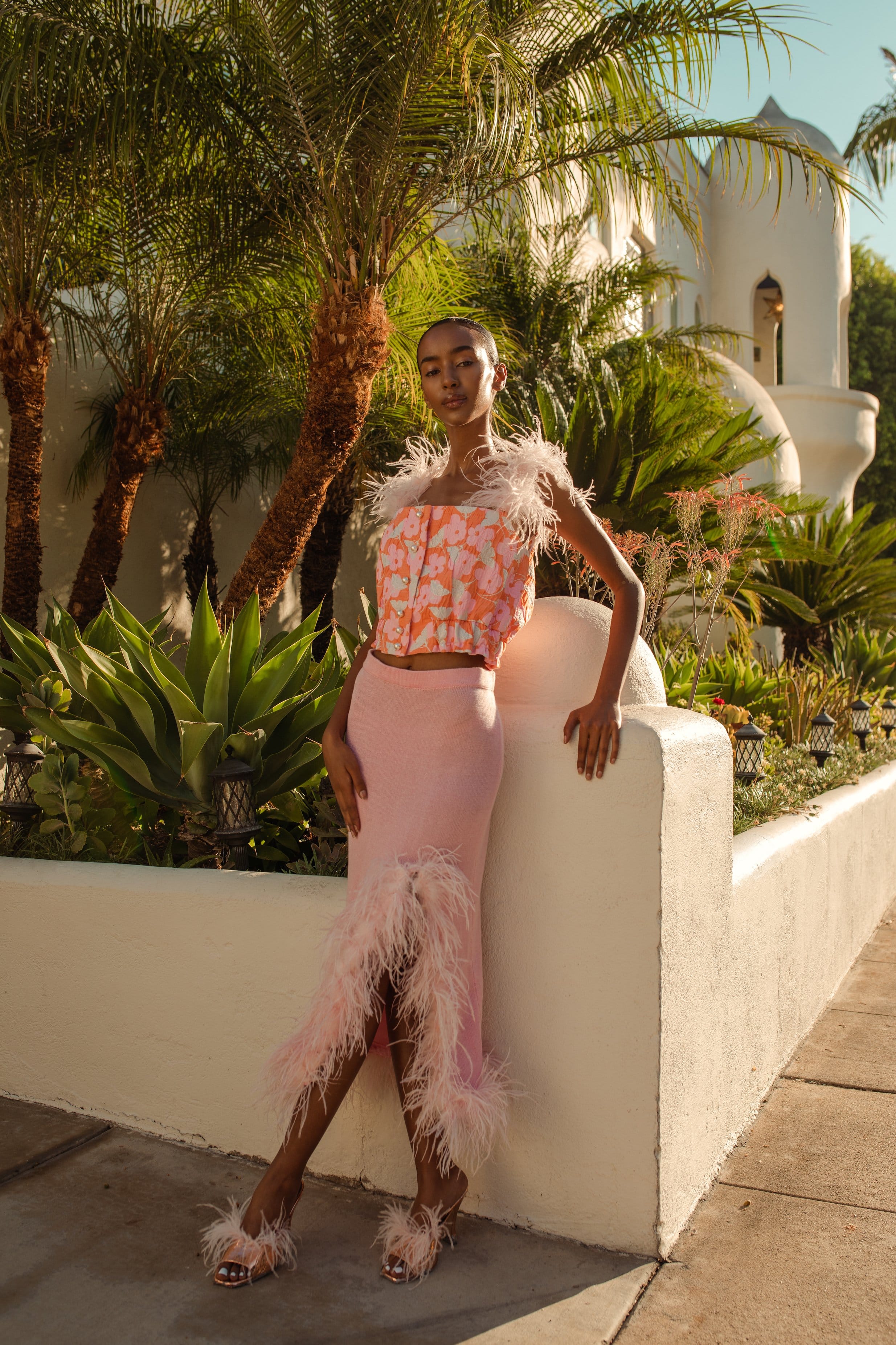 Pink flower top with feather details and pearl buttons in Pink made by ANDREEVA