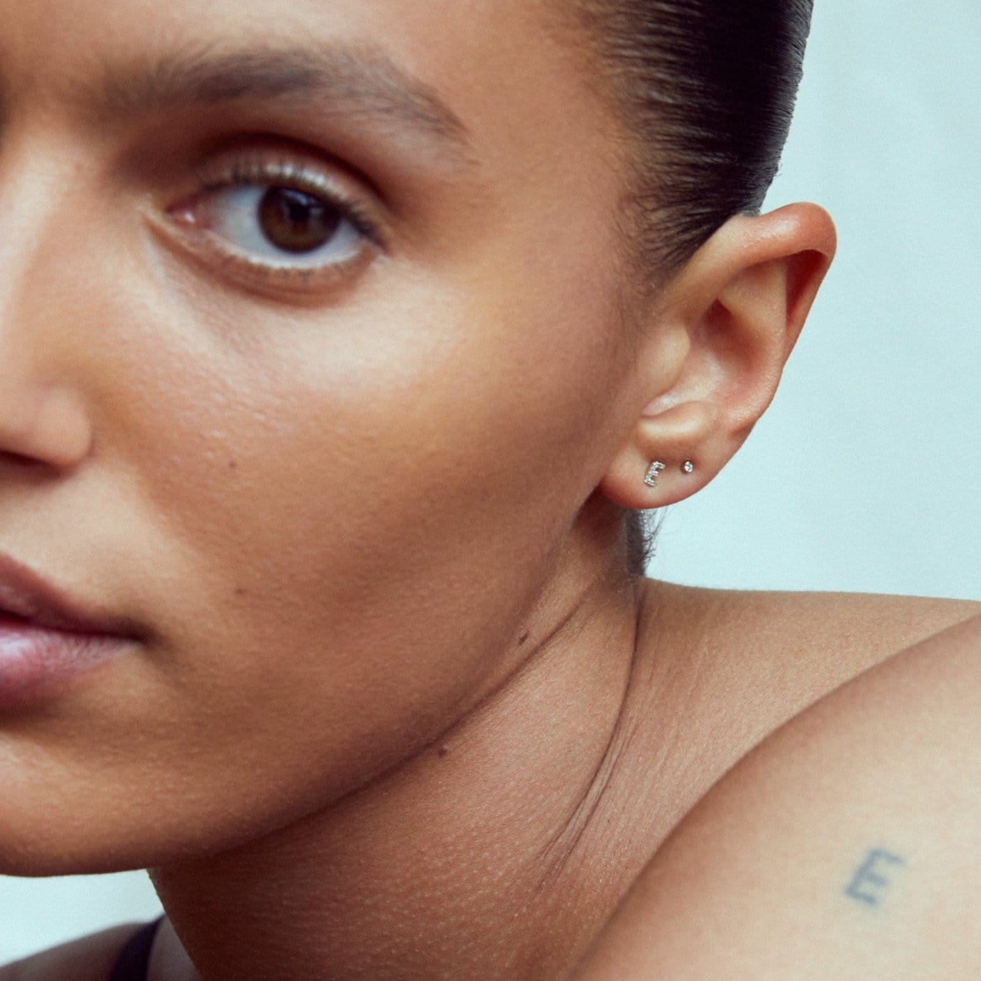 PETITE LETTER STUD - WHITE DIAMONDS & WHITE GOLD made by ENNUI